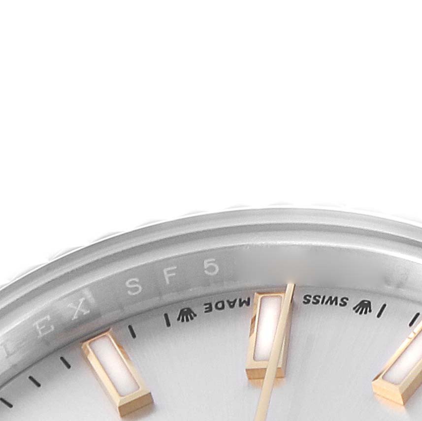The image shows a close-up of the Rolex Datejust 279173 Women
s Steel and Gold (two tone) Silver Dial watch face, highlighting the indices, hands, and "Swiss Made" text.