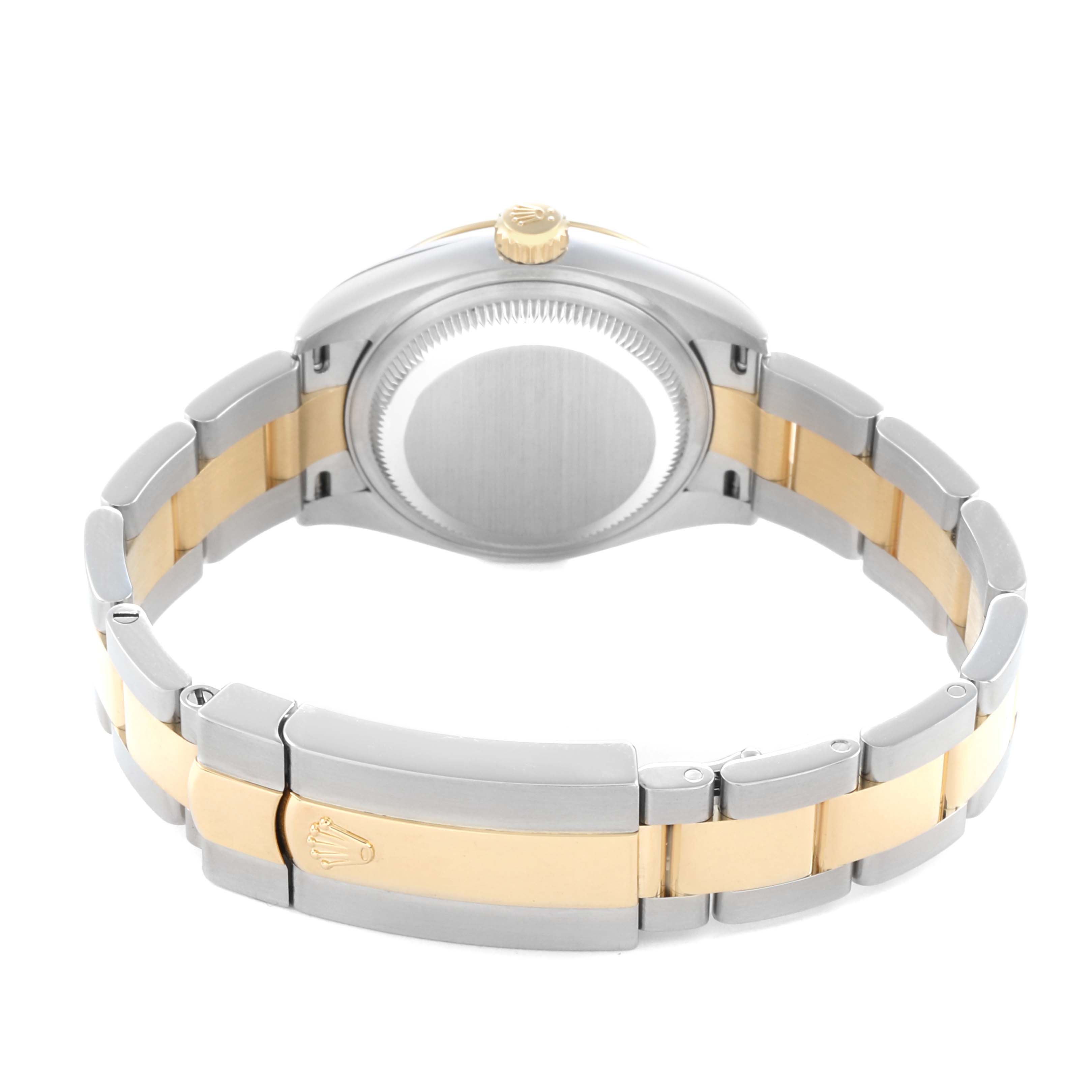 The Rolex Datejust 279173 Women
s Steel and Gold (two tone) Silver Dial is shown from the back, highlighting the stainless steel and gold bracelet and the case back.