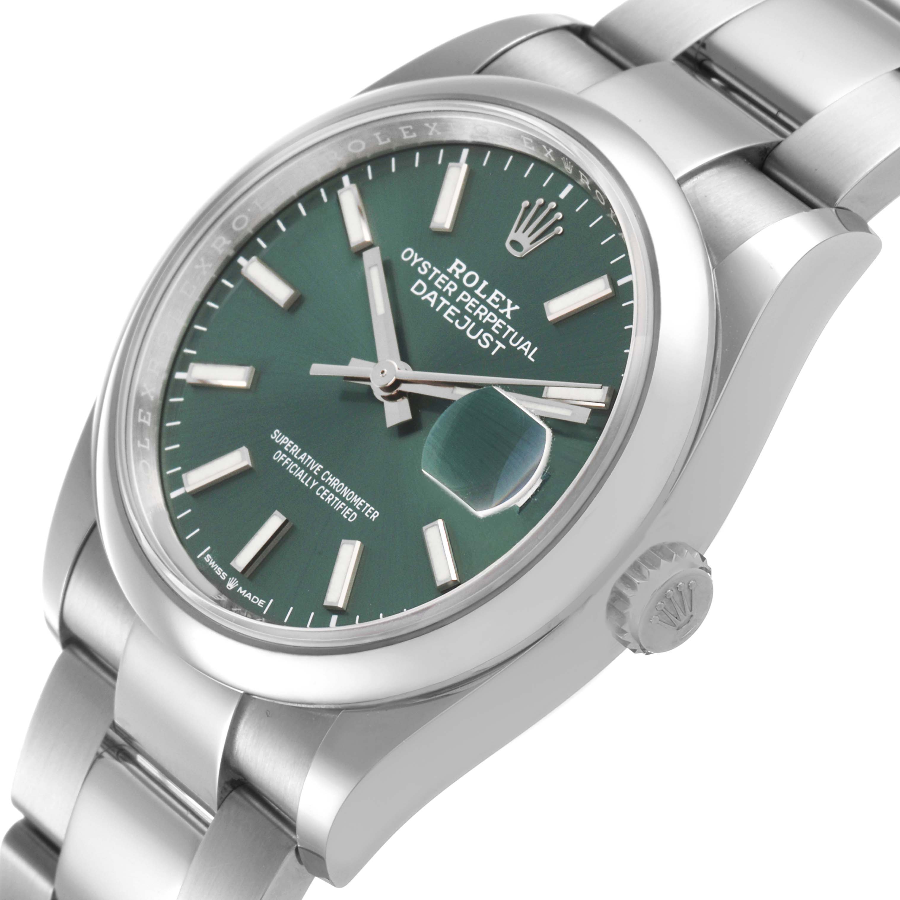 The image shows a Rolex Datejust 126200 Men's Stainless Steel Green Dial watch at a slight angle, highlighting the green dial, bezel, crown, and part of the bracelet.