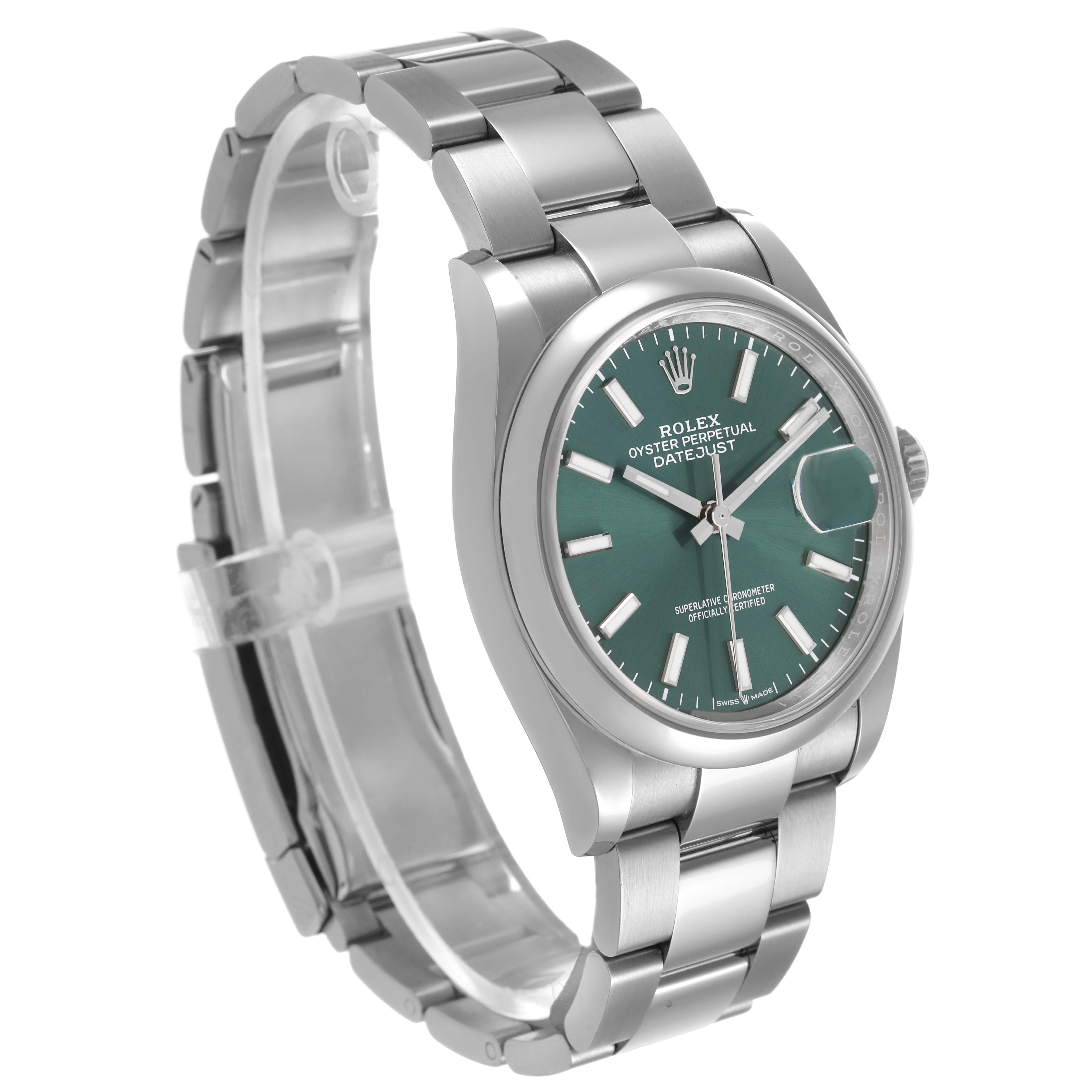 The Rolex Datejust 126200 Men's Stainless Steel Green Dial watch is shown at a three-quarter angle, highlighting the green dial, case, bracelet, and bezel.