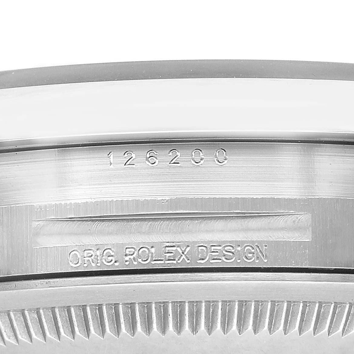 The image shows a close-up of the side of a Rolex Datejust 126200 Men's Stainless Steel Green Dial, featuring the model number and "ORIG. ROLEX DESIGN" engraving.