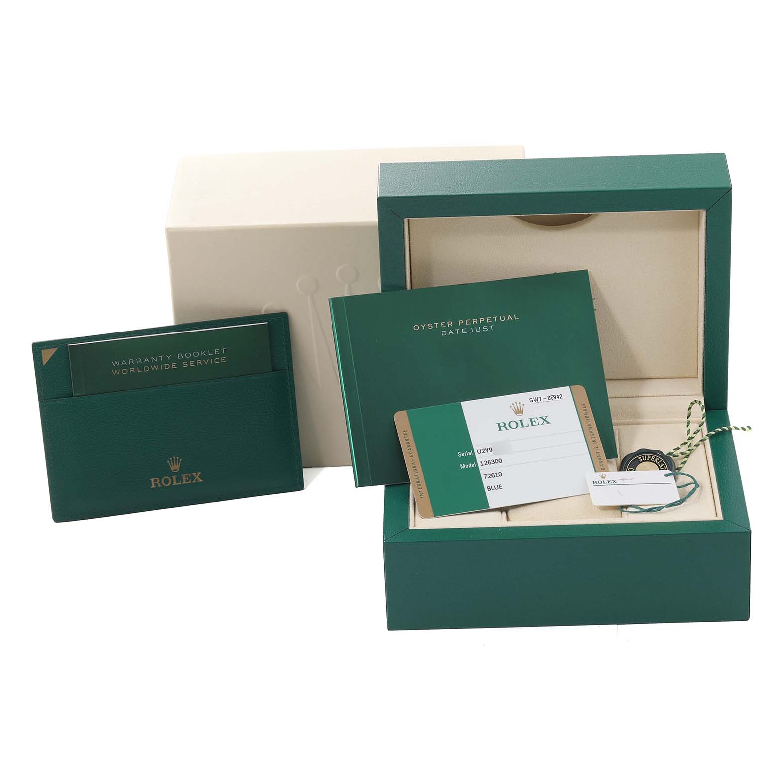 The image shows packaging and accessories for a Rolex Datejust 41 126300 Men
s Stainless Steel Blue Dial 126300 Men
s Stainless Steel Blue Dial including the box, warranty booklet, and certification card.