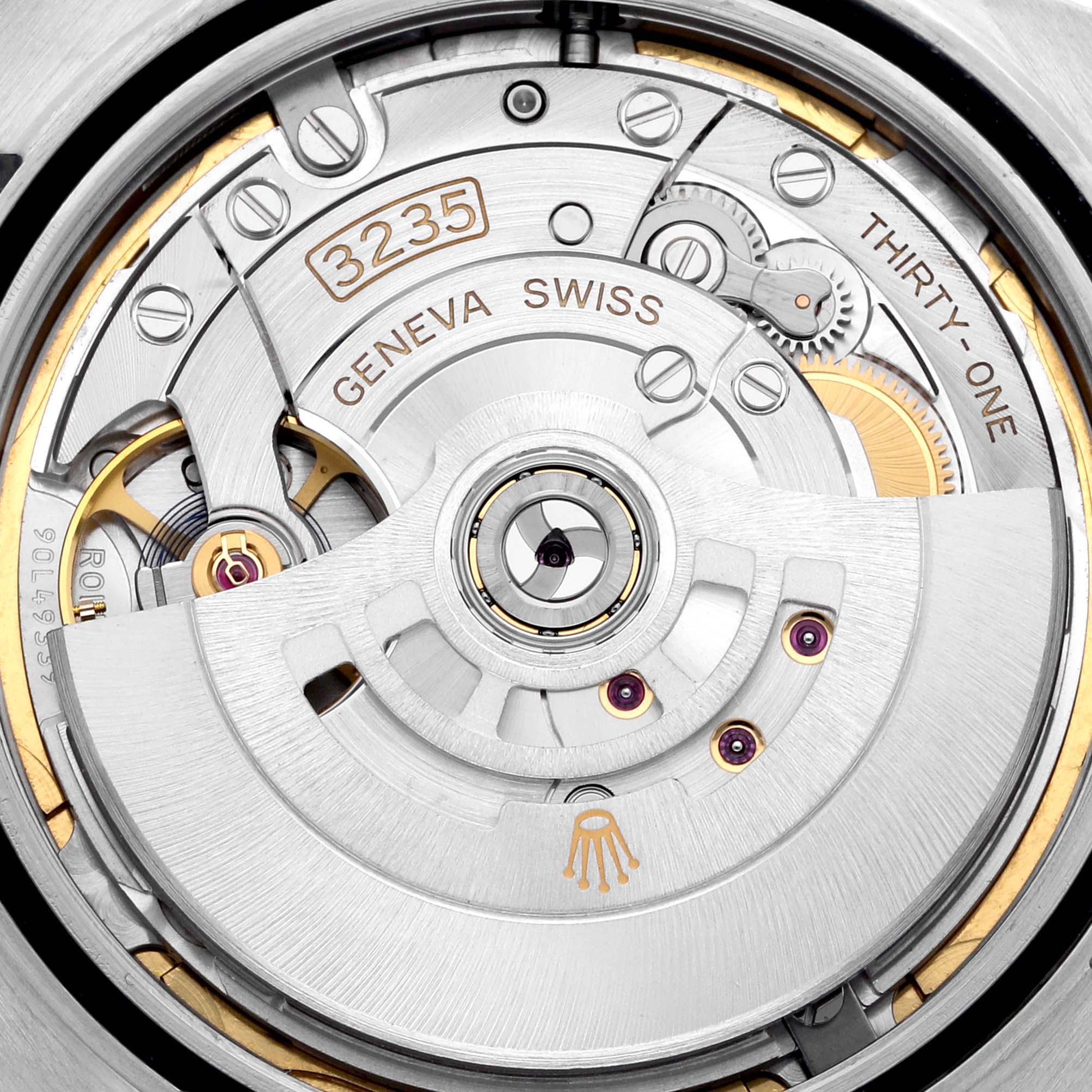 The image shows a close-up of the movement of a Rolex Datejust 41 126300 Men
s Stainless Steel Blue Dial 126300 Men
s Stainless Steel Blue Dial, displaying intricate components and the "3235" caliber.