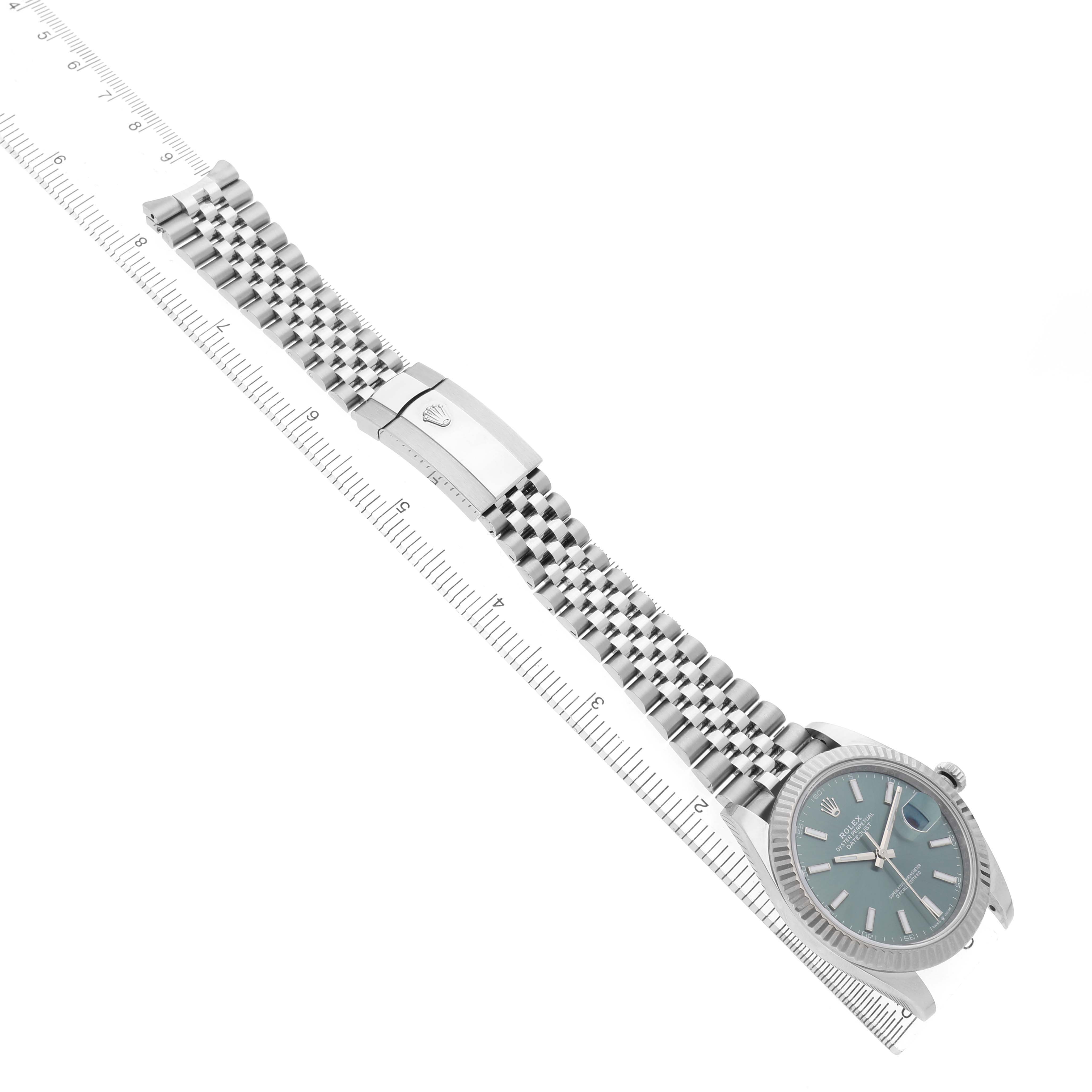The Rolex Datejust 41 126334 Men's Stainless Steel Green Dial watch is shown laid flat with an open bracelet, highlighting the dial, crown, jubilee bracelet, and clasp.