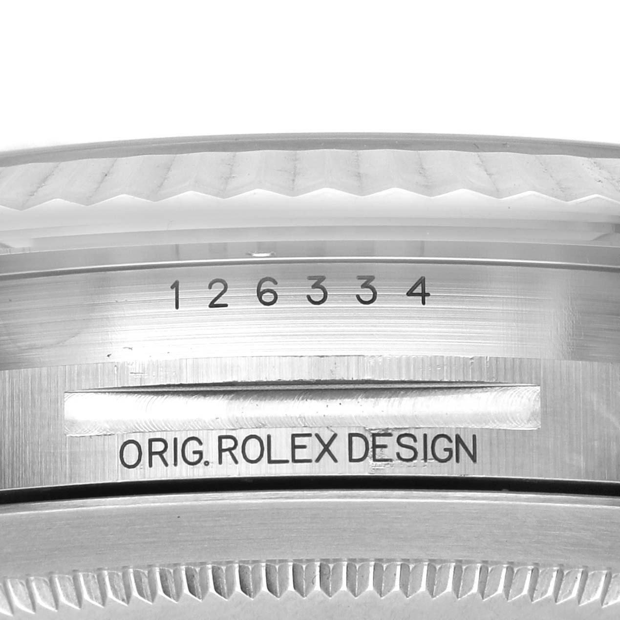 The image shows a close-up of the case profile and bezel of a Rolex Datejust 41 126334 Men's Stainless Steel Green Dial, highlighting the serial number and "ORIG. ROLEX DESIGN" engraving.