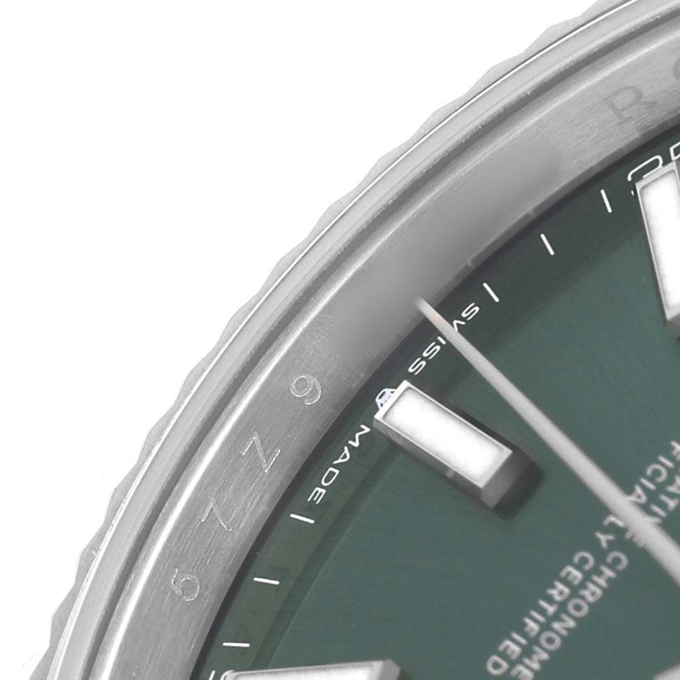 The image shows a partial view of the Rolex Datejust 41 126334 Men's Stainless Steel Green Dial, focusing on the green dial, indices, and bezel.