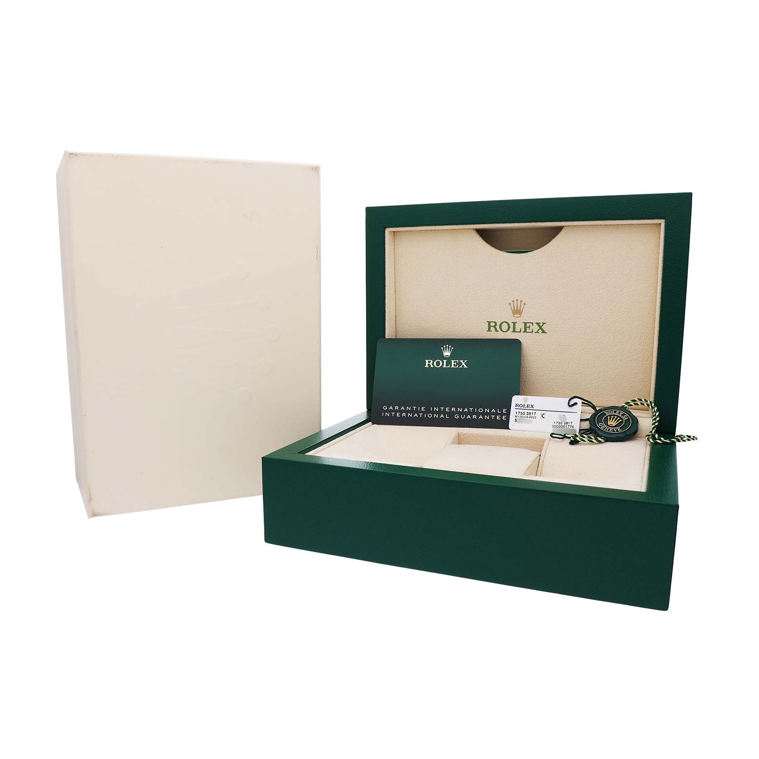 This image shows the Rolex Datejust 41 126334 Men's Stainless Steel Grey Dial packaging, including the box, warranty card, and tags, viewed from an angle to the front right.