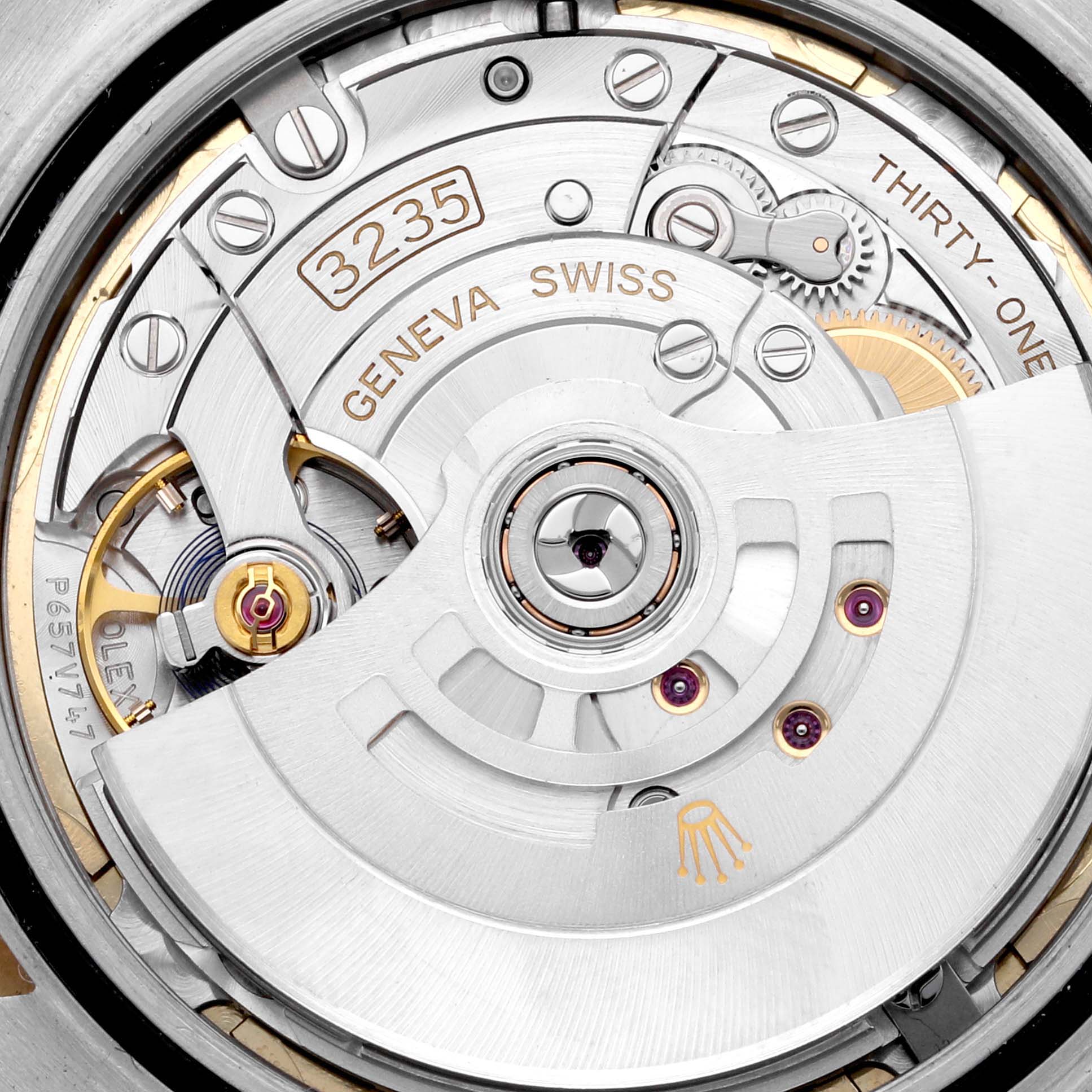 The image shows a close-up of the movement mechanism inside a Rolex Datejust 41 126333 Men's Steel and Gold (two tone) Champagne Dial 126333 Men's Steel and Gold (two tone) Champagne Dial watch.