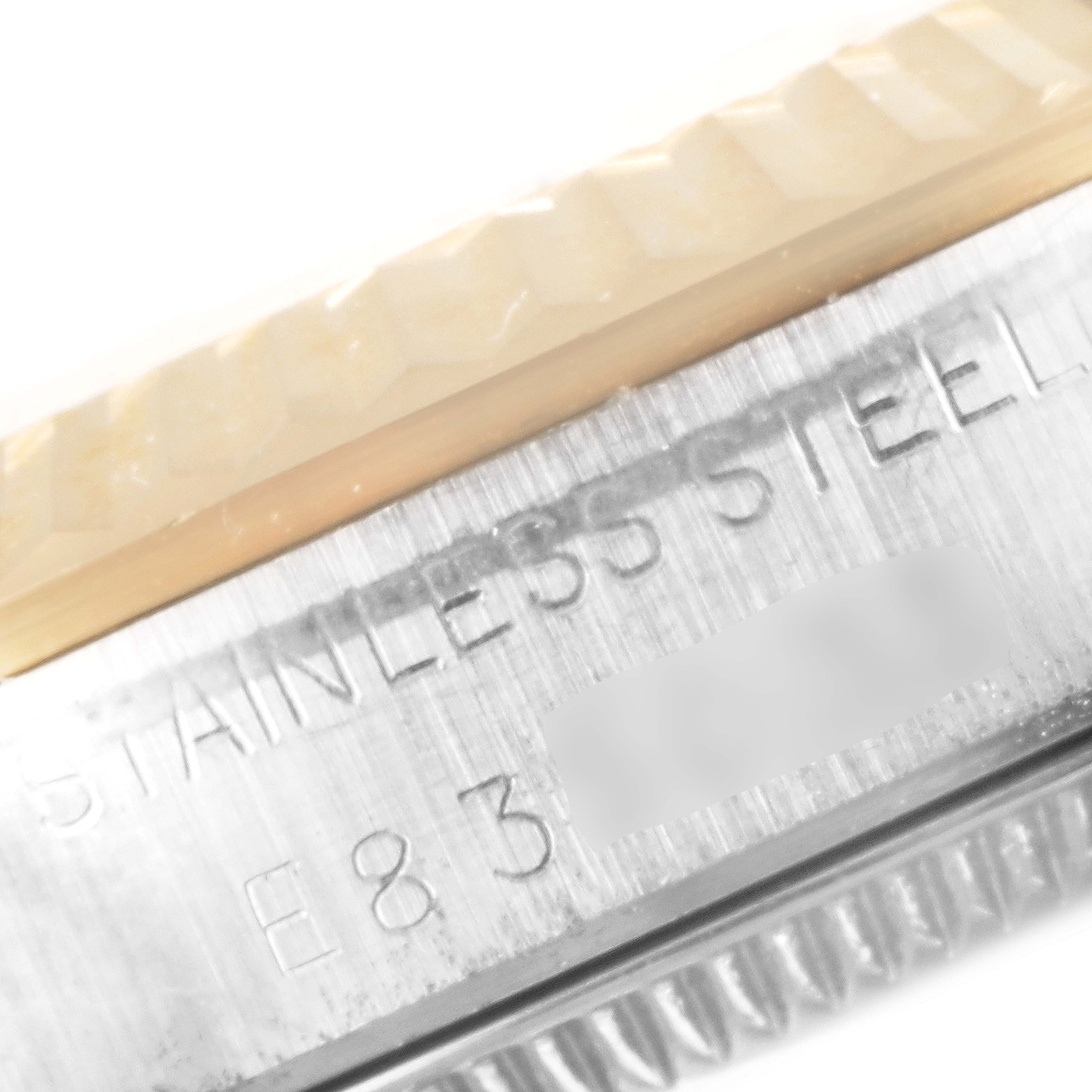 The image shows a close-up side view of a Mid-Size Rolex watch, highlighting the stainless steel case with engraved markings.