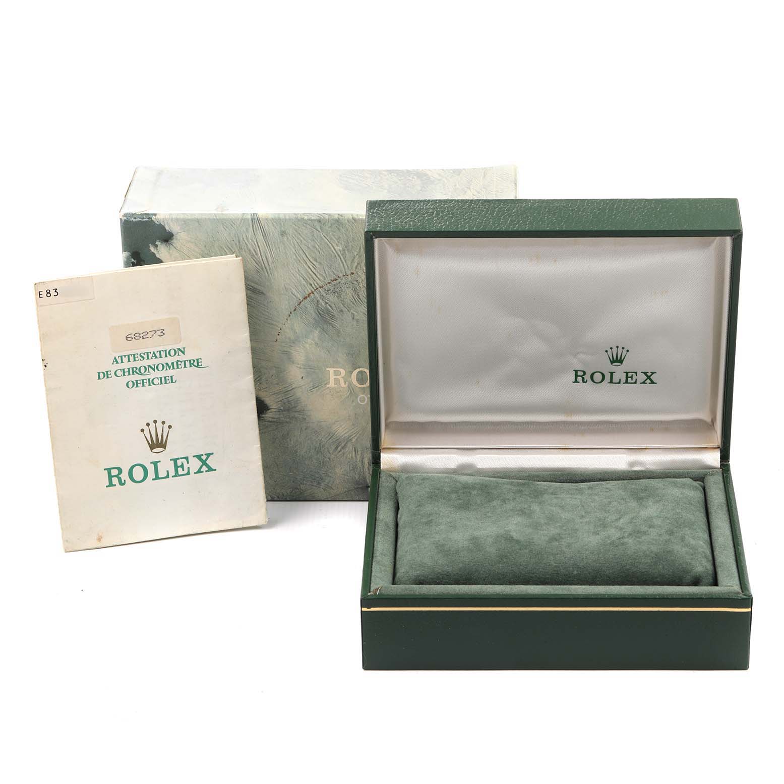 The image shows a Rolex Mid-Size 68273 Women
s Steel and Gold (two tone) White Dial 68273 Women
s Steel and Gold (two tone) White Dial model watch box, an outer box, and an official chronometer certificate from a top angle.