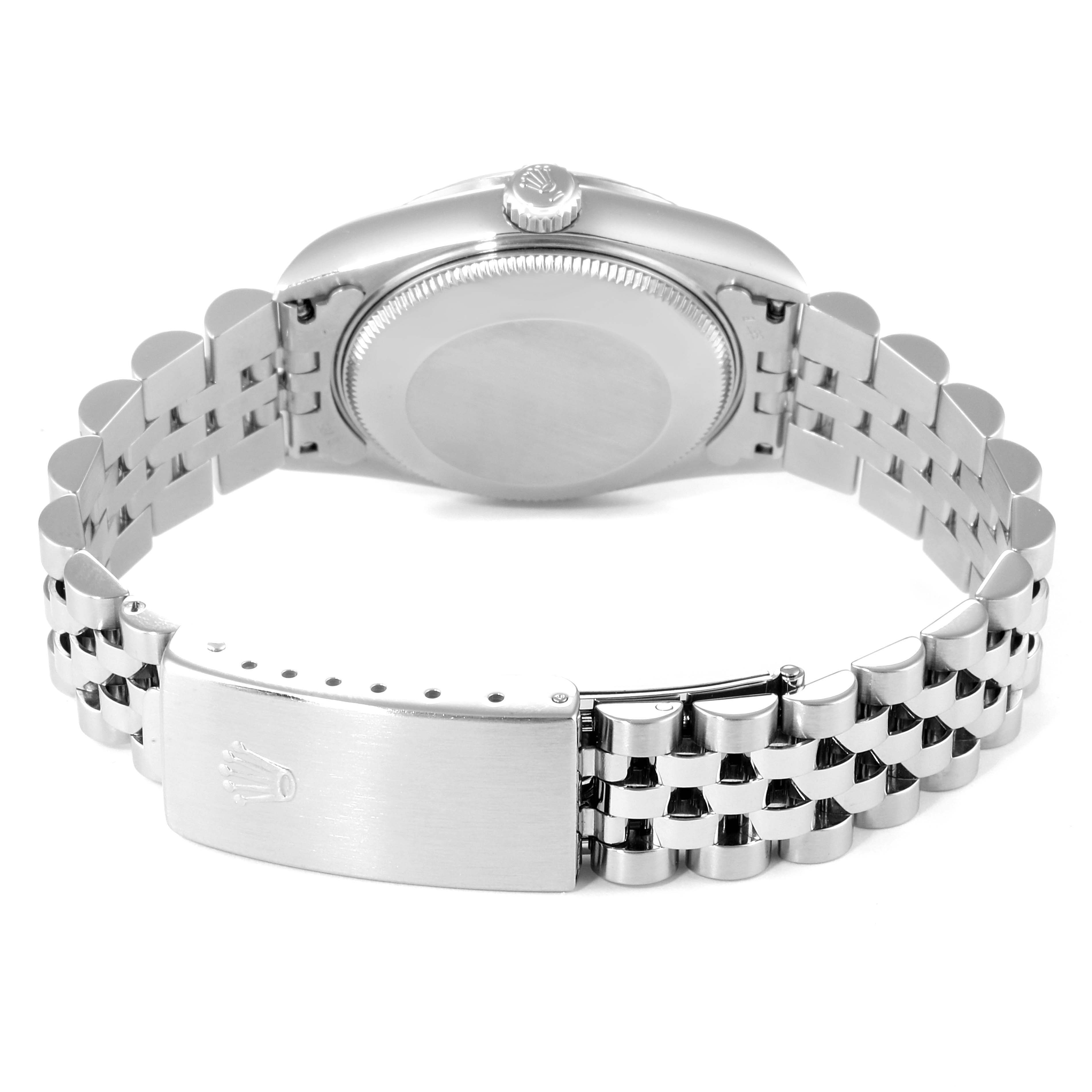The image shows the back case and Jubilee bracelet of the mid-size Rolex watch from a rear angle.