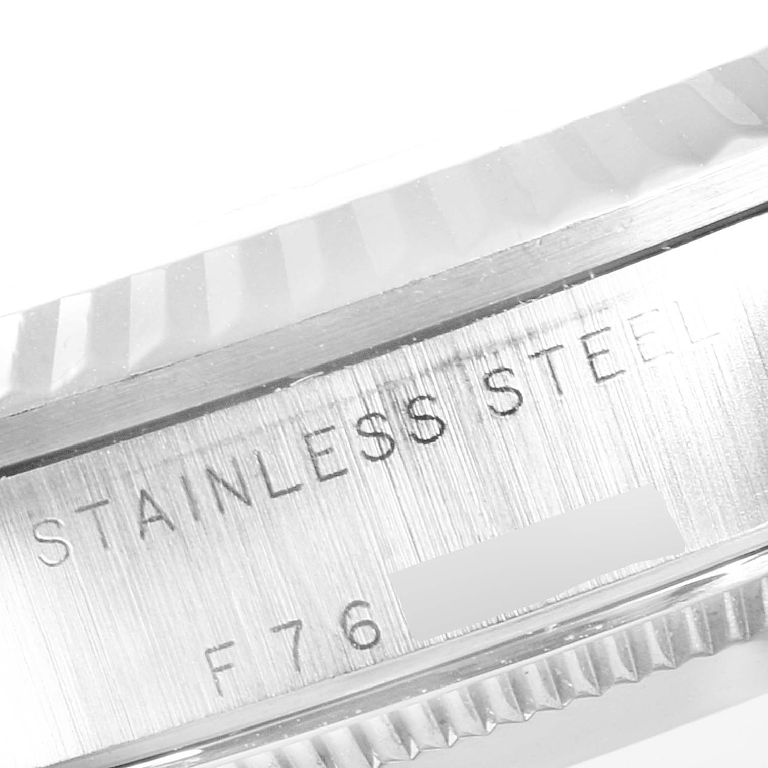 The image shows a close-up of the side of the Rolex Mid-Size 78274 Women
s Stainless Steel White Dial 78274 Women
s Stainless Steel White Dial model watch, highlighting its stainless steel material and part of its serial number.