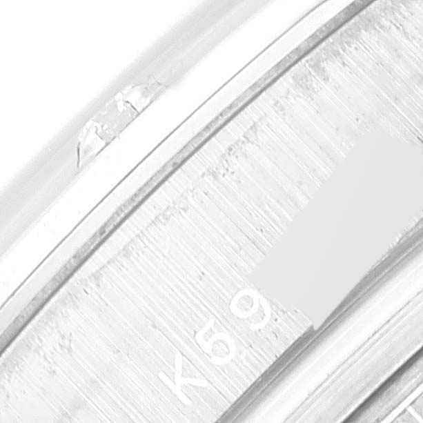 This is a close-up of the serial number engraving on the case of a Rolex Pearlmaster 80319 Women's White Gold Silver Dial 80319 Women's White Gold Silver Dial watch.