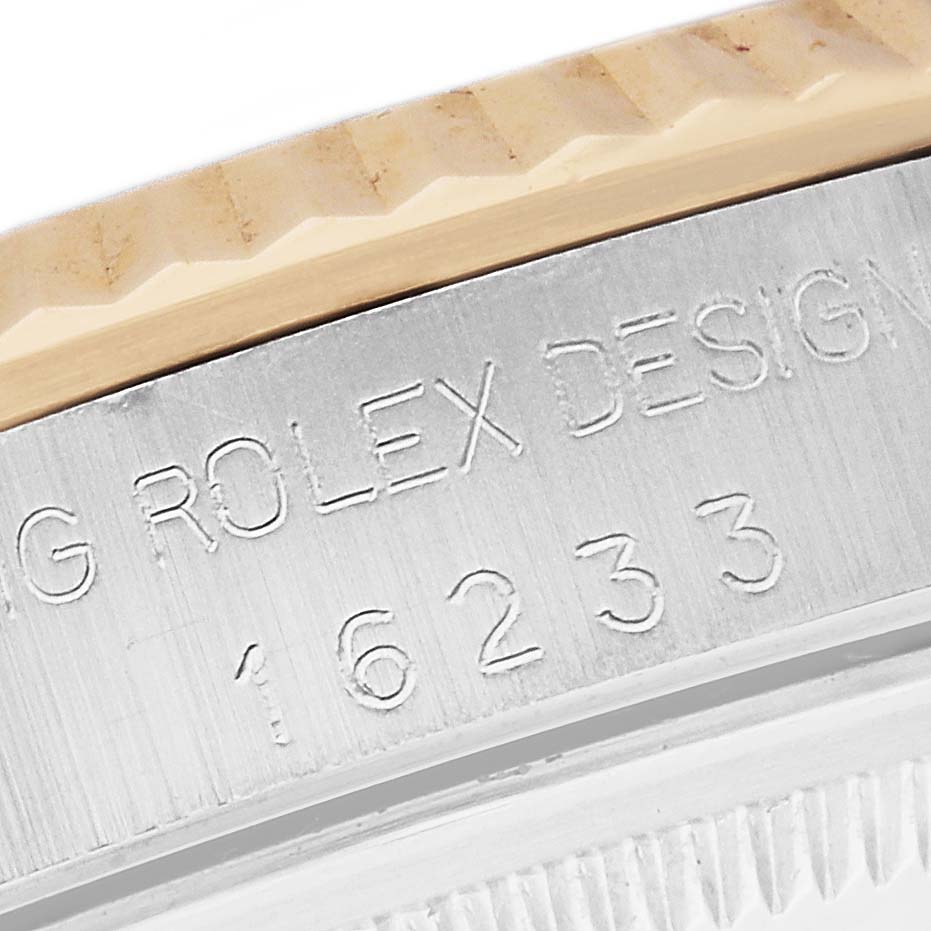 This image shows a close-up view of the case side and bezel of a Rolex Datejust 16233 Men's Steel and Gold (two tone) Black Dial 16233 Men's Steel and Gold (two tone) Black Dial watch with the model number 16233 engraved.