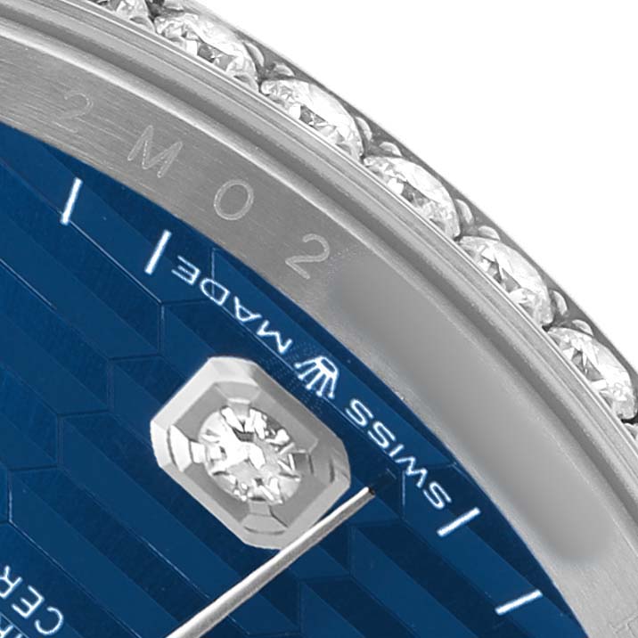 The image shows a close-up of the Rolex Datejust 126284 Men's Stainless Steel Blue Dial, highlighting the bezel, part of the blue dial, and diamond markers.