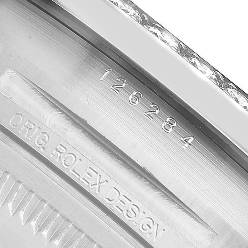 The image shows an angled close-up of the case back with engravings on a Rolex Datejust 126284 Men's Stainless Steel Blue Dial model.