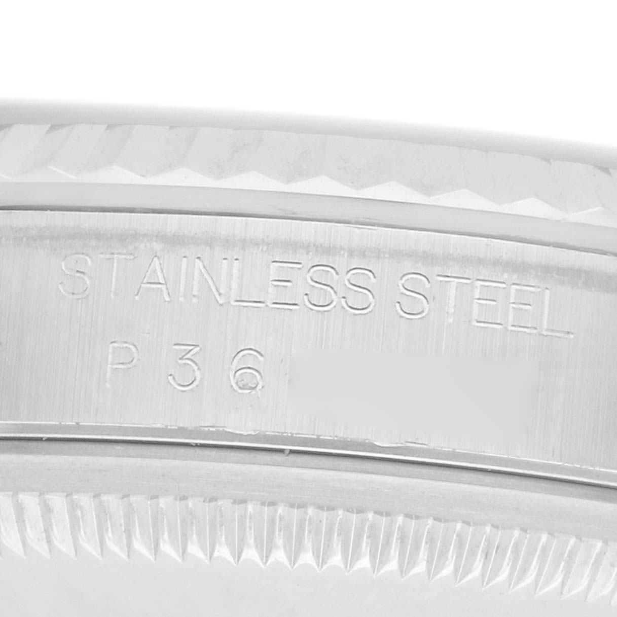 This image shows a close-up of the Rolex Datejust 16234 Men
s Stainless Steel Black Dial model focusing on the stainless steel fluted bezel and engraving.