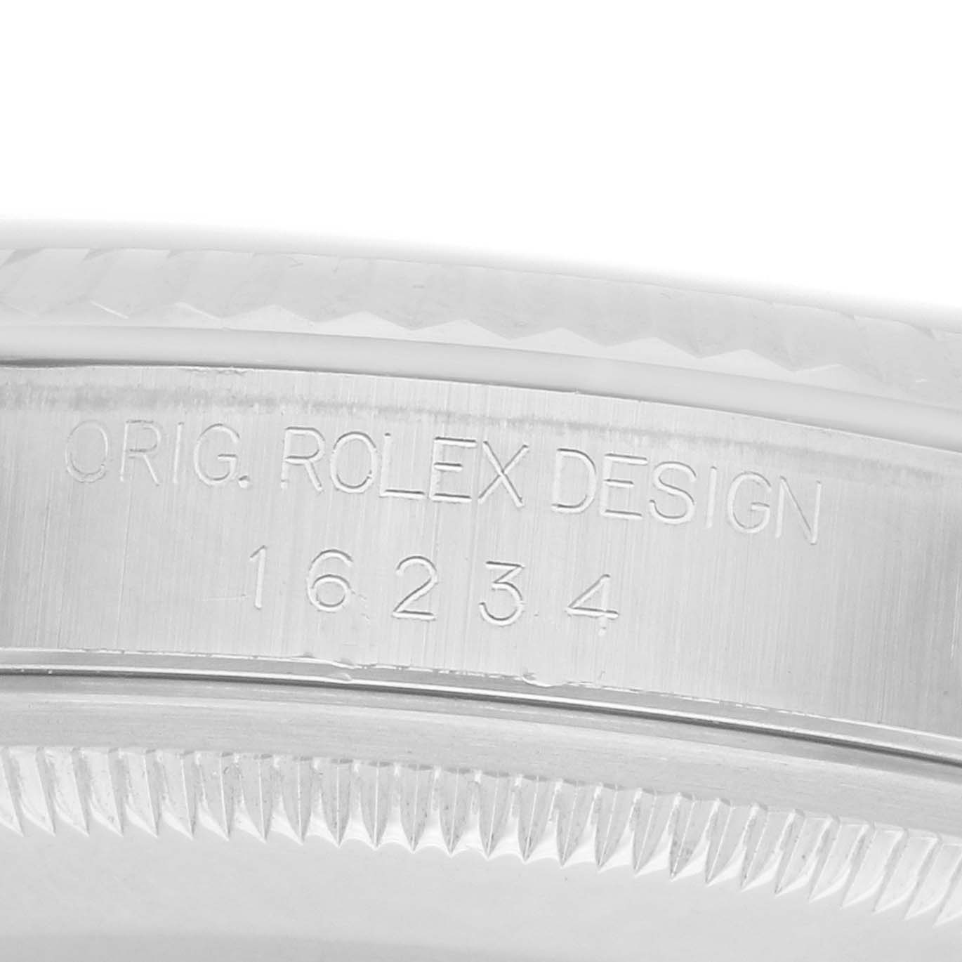 This image shows a close-up of the case side of a Rolex Datejust 16234 Men
s Stainless Steel Black Dial, displaying the engraved model number.