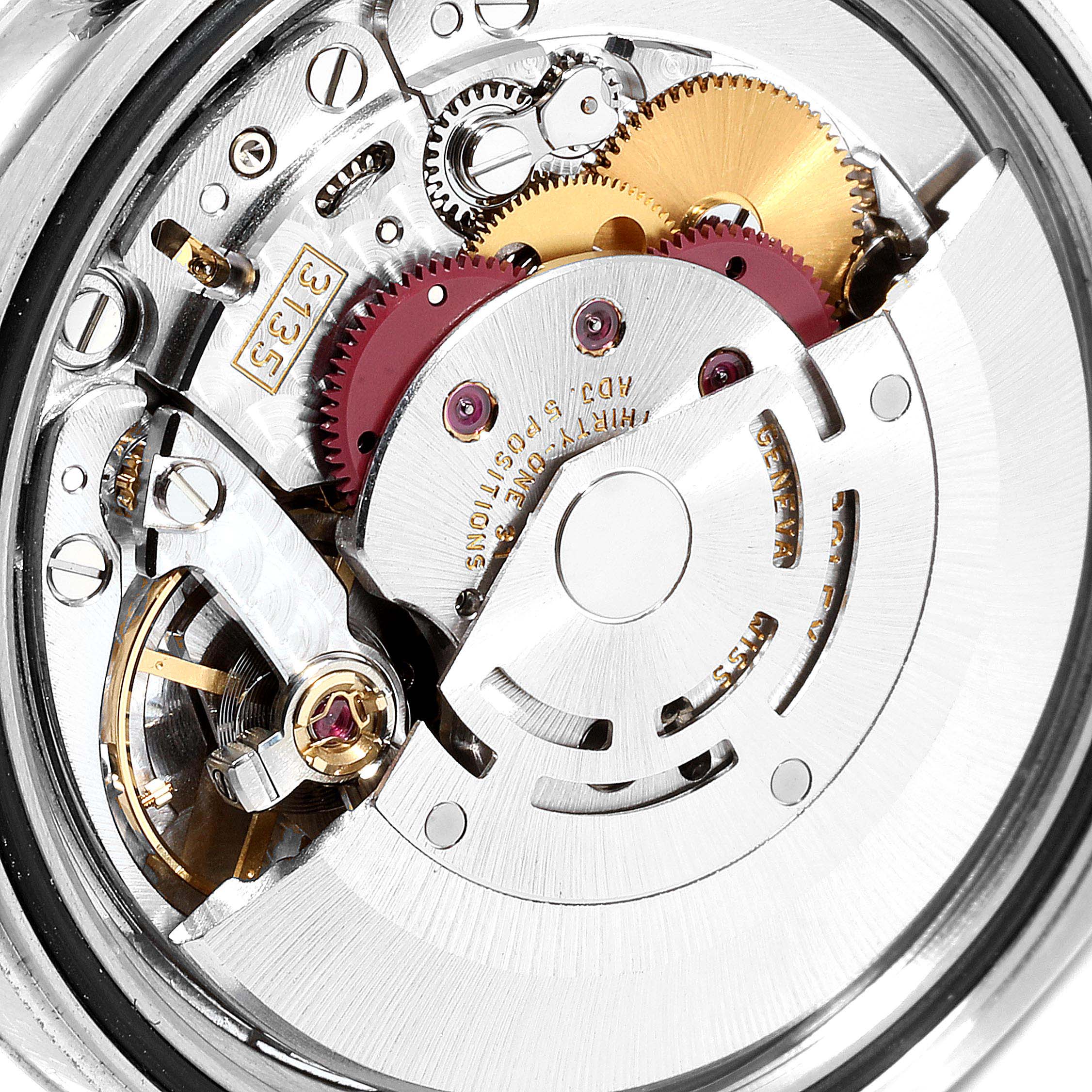 This image shows a close-up view of the movement mechanism of a Rolex Datejust 116234 Men's Stainless Steel Black Dial 116234 Men's Stainless Steel Black Dial watch.