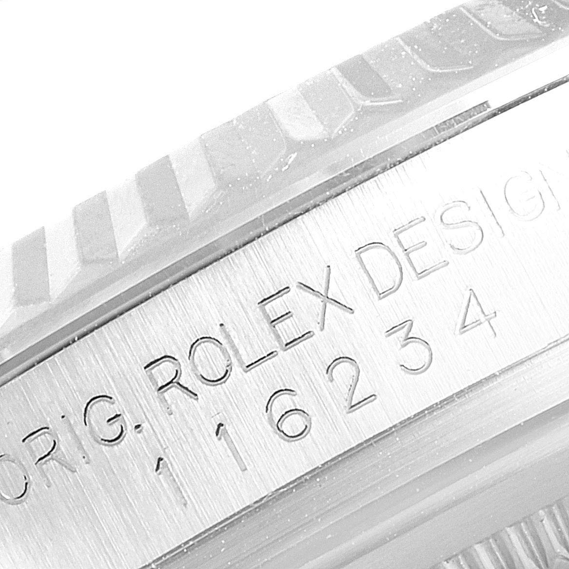 The image shows a close-up view of the model number and fluted bezel on a Rolex Datejust 116234 Men's Stainless Steel Black Dial 116234 Men's Stainless Steel Black Dial watch.