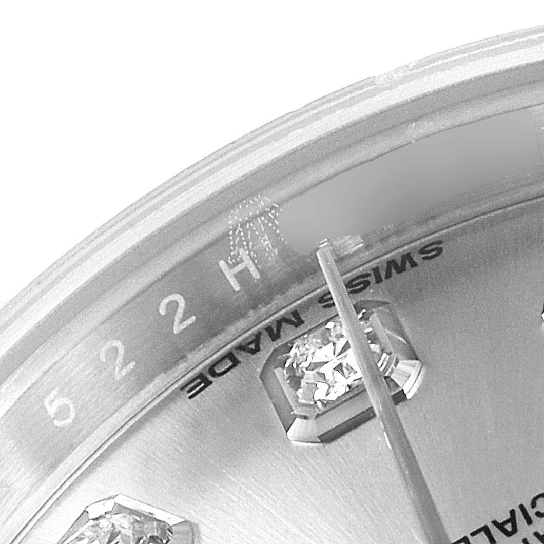 A close-up of the Rolex Datejust 179174 Women's Stainless Steel Silver Dial 179174 Women's Stainless Steel Silver Dial watch shows the upper part of the dial's edge, including diamond hour markers and "Swiss Made" text.