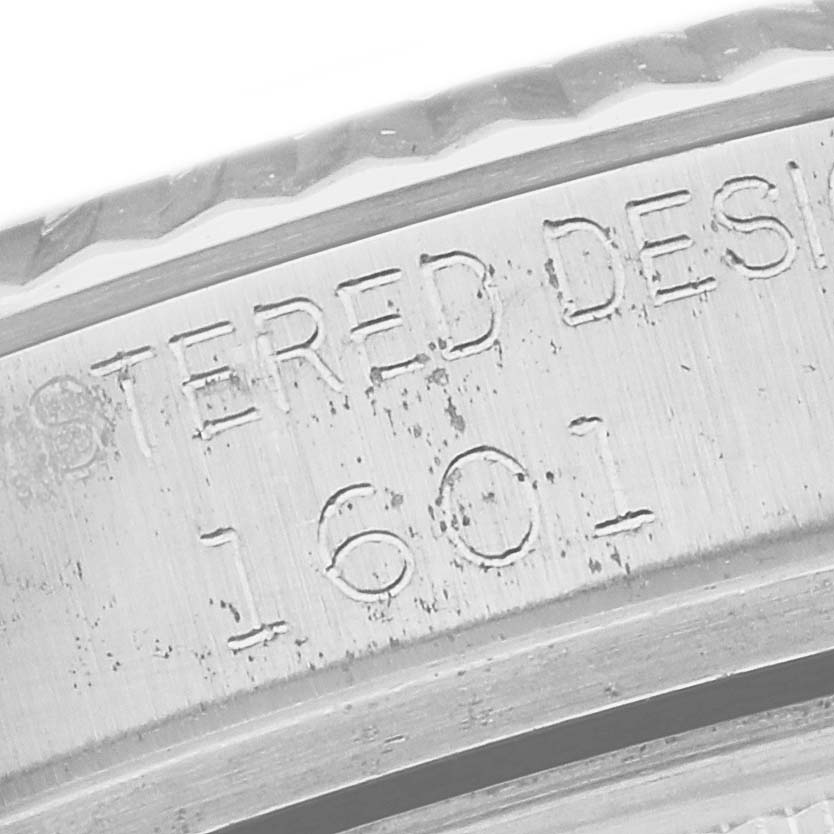 This close-up image shows the engraved model number "1601" on the side of the Rolex Vintage Collection 1601 Men's Stainless Steel Silver Dial 1601 Men's Stainless Steel Silver Dial watch case.
