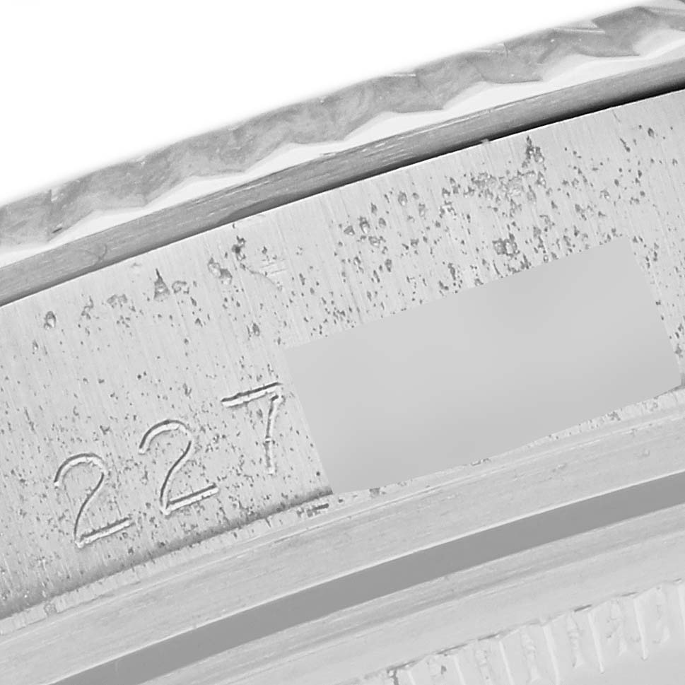 This image shows a close-up of the serial number engraving on a Rolex Vintage Collection 1601 Men's Stainless Steel Silver Dial 1601 Men's Stainless Steel Silver Dial watch case.