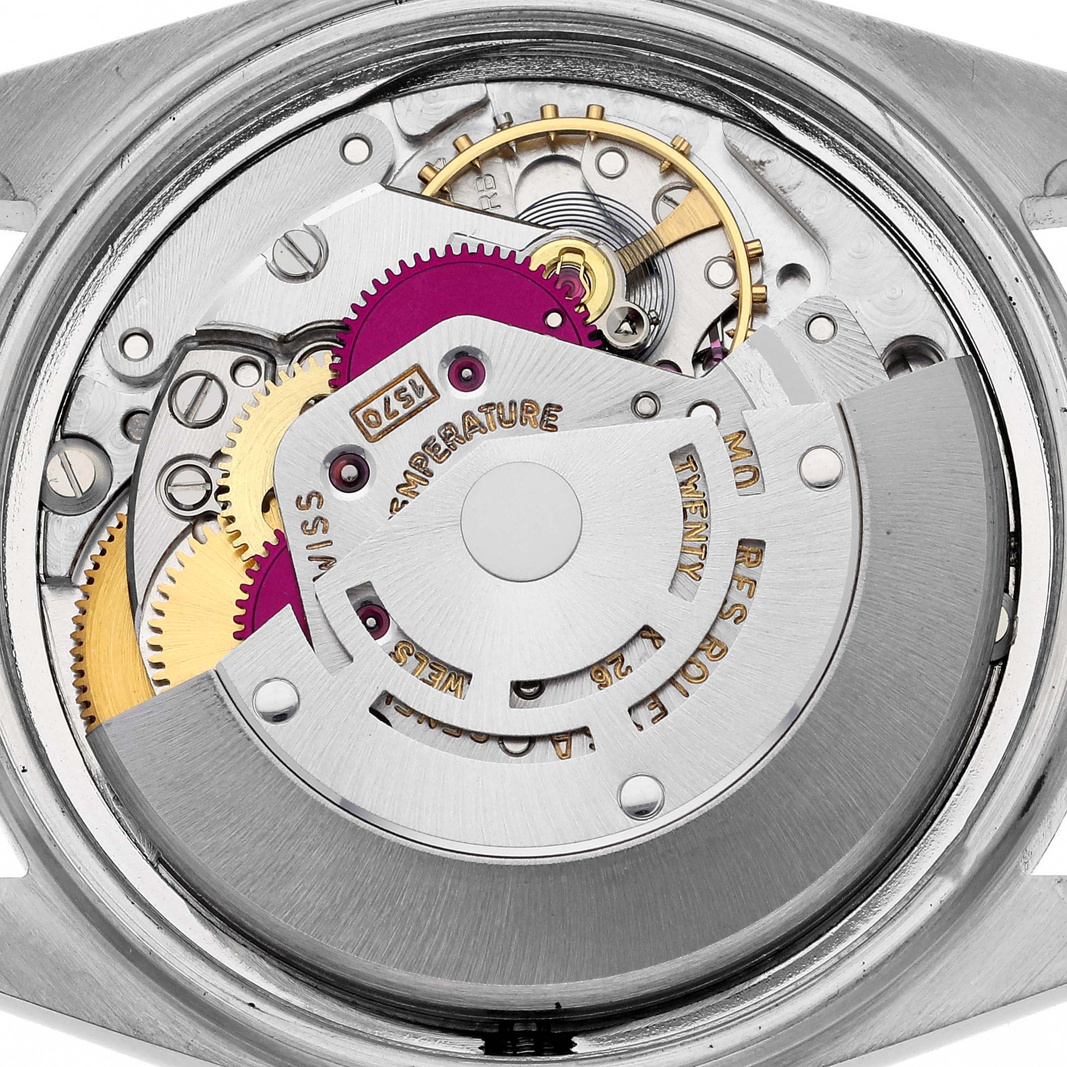 The image shows a close-up view of the internal mechanism of a Rolex Vintage Collection 1601 Men's Stainless Steel Silver Dial 1601 Men's Stainless Steel Silver Dial watch, highlighting its gears and rotor.