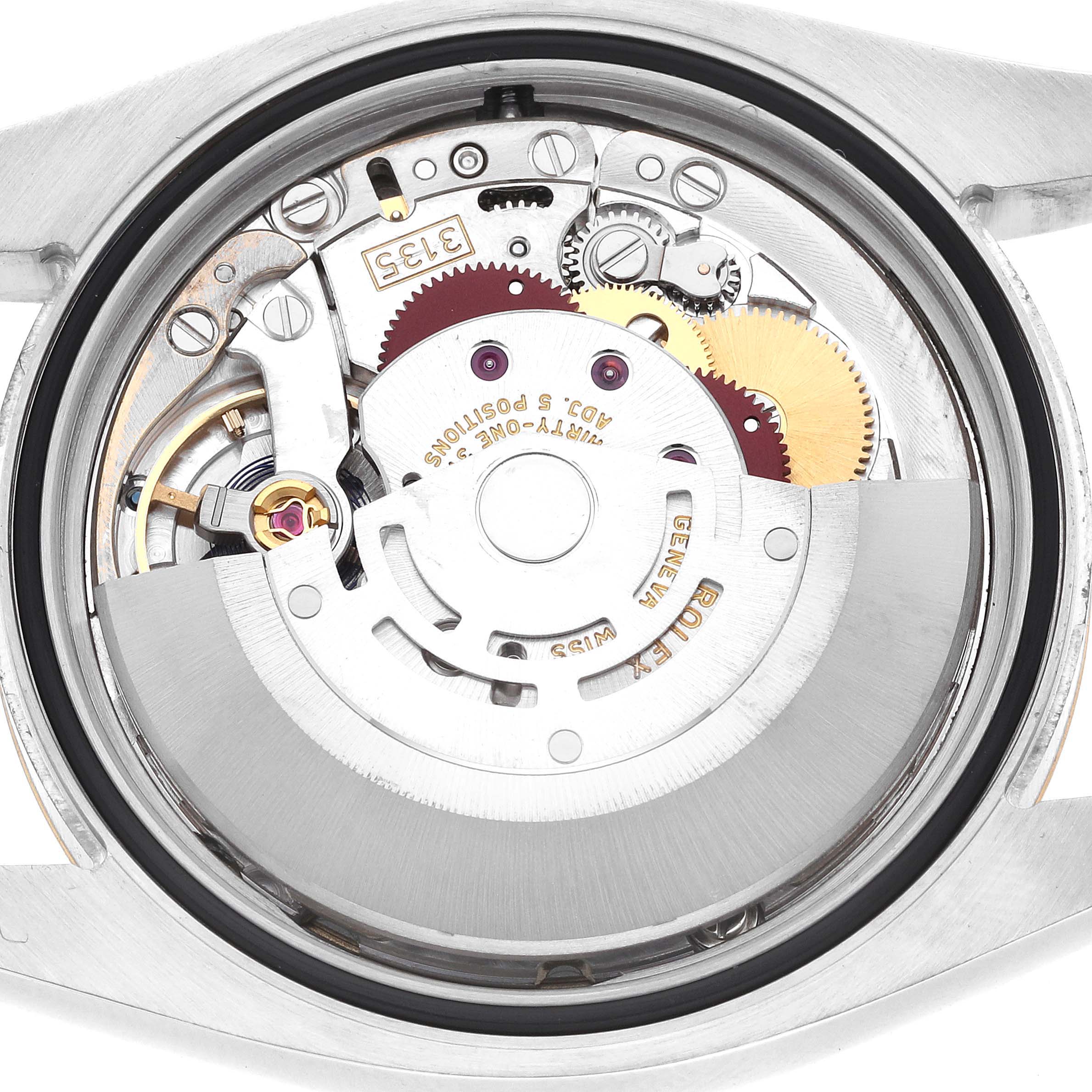 The image shows the back view of a Rolex Datejust 116233 Men
s Steel and Gold (two tone) Champagne Dial, revealing its internal movement components.