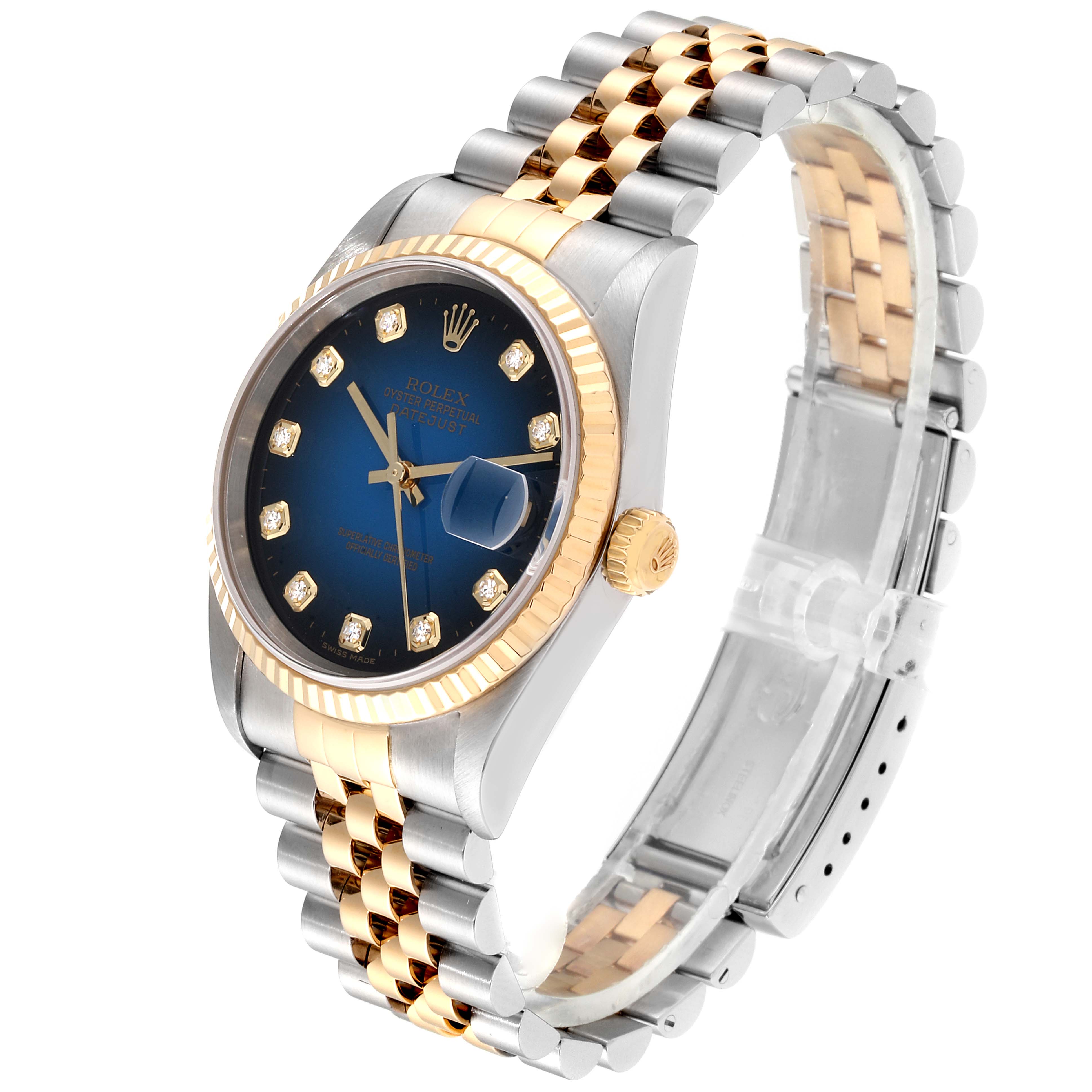 The image shows a side angle of the Rolex Datejust 16233 Men's Steel and Gold (two tone) Blue Dial 16233 Men's Steel and Gold (two tone) Blue Dial watch, featuring its blue dial, two-tone bracelet, and fluted bezel.