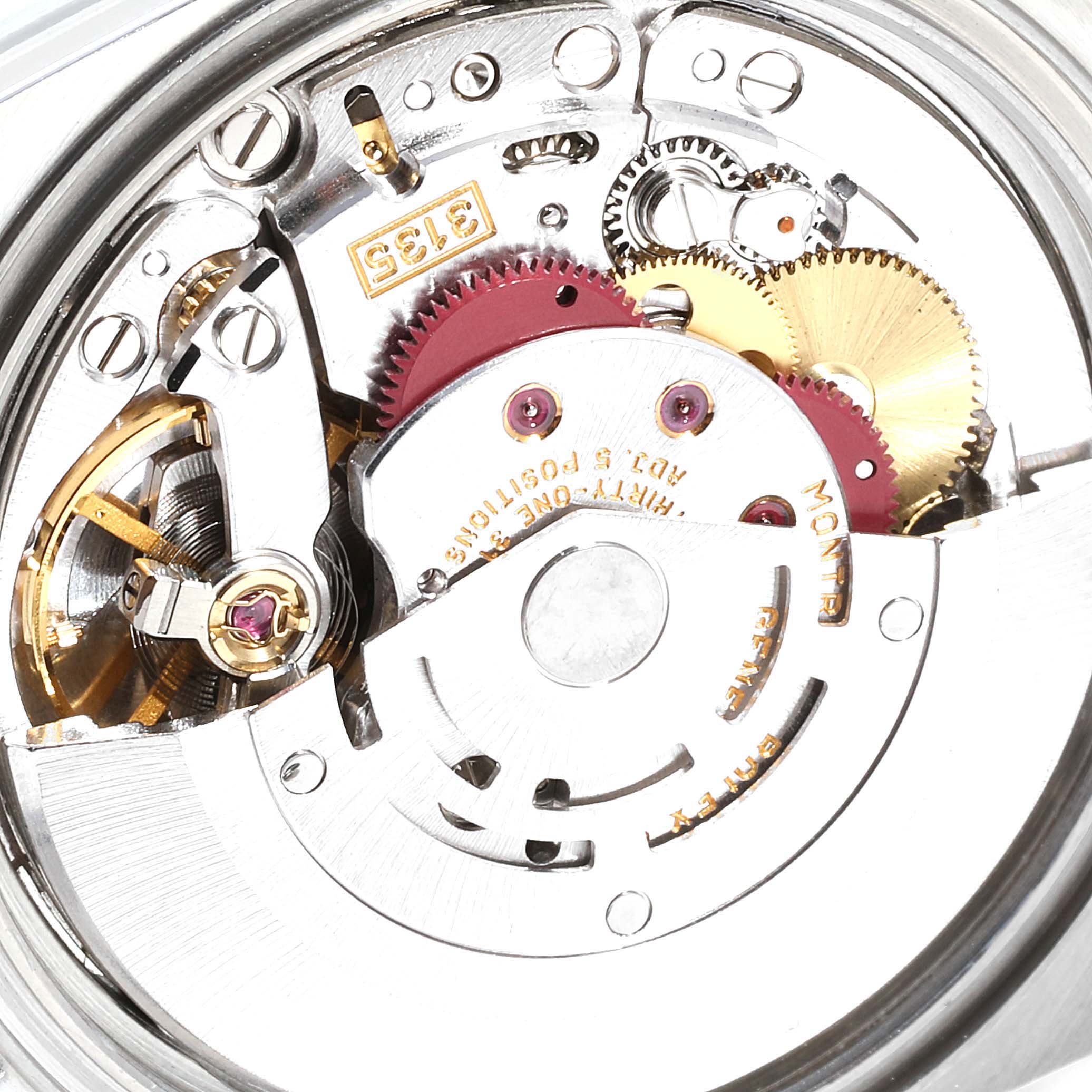 This image shows the internal mechanism of a Rolex Datejust 16233 Men's Steel and Gold (two tone) Blue Dial 16233 Men's Steel and Gold (two tone) Blue Dial watch, focusing on gears and the balance wheel assembly.