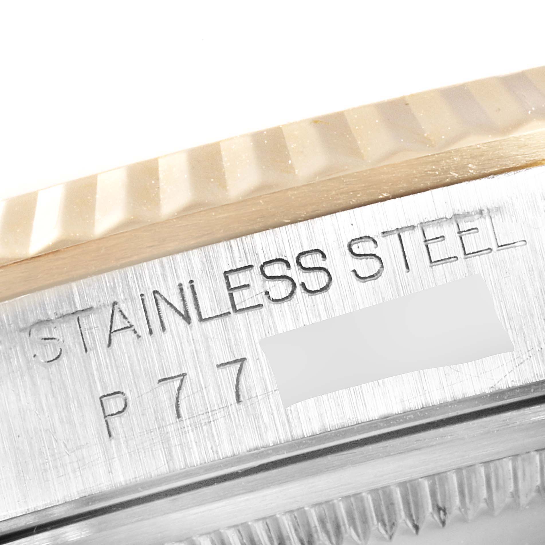 The image shows a close-up of the engraved text on the caseback of a Rolex Datejust 16233 Men's Steel and Gold (two tone) Blue Dial 16233 Men's Steel and Gold (two tone) Blue Dial watch.