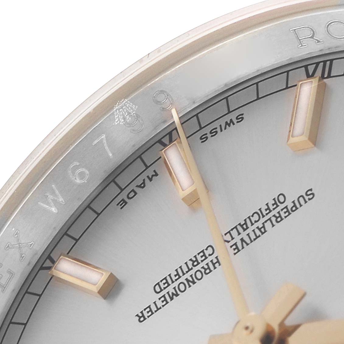 The image shows a close-up of the Rolex Datejust 116233 Men
s Steel and Gold (two tone) Silver Dial face, highlighting the indices, hands, and markings.
