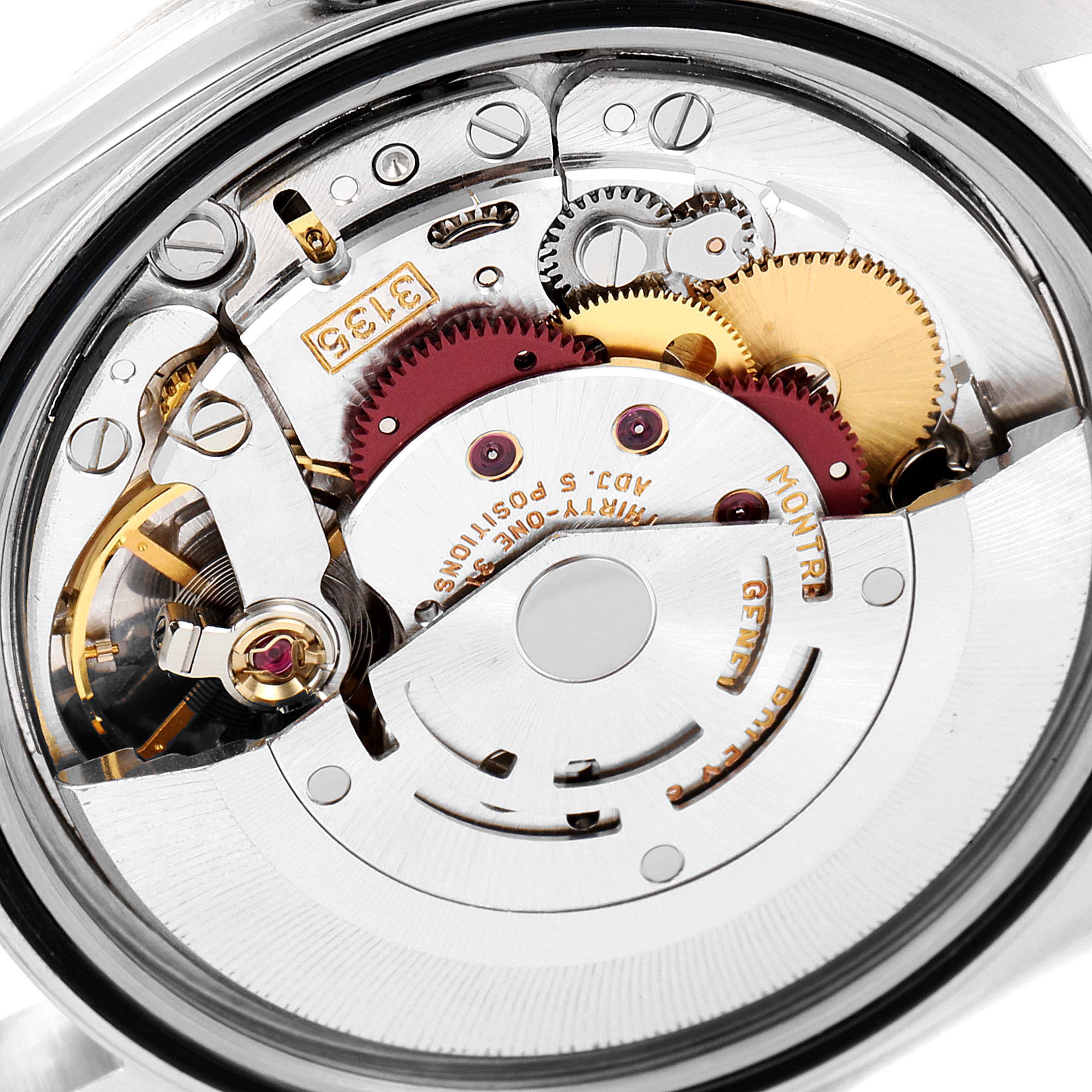 This image shows the inner mechanism of a Rolex Datejust 16233 Men's Steel and Gold (two tone) Blue Dial 16233 Men's Steel and Gold (two tone) Blue Dial watch, highlighting gears and components at a close-up angle.