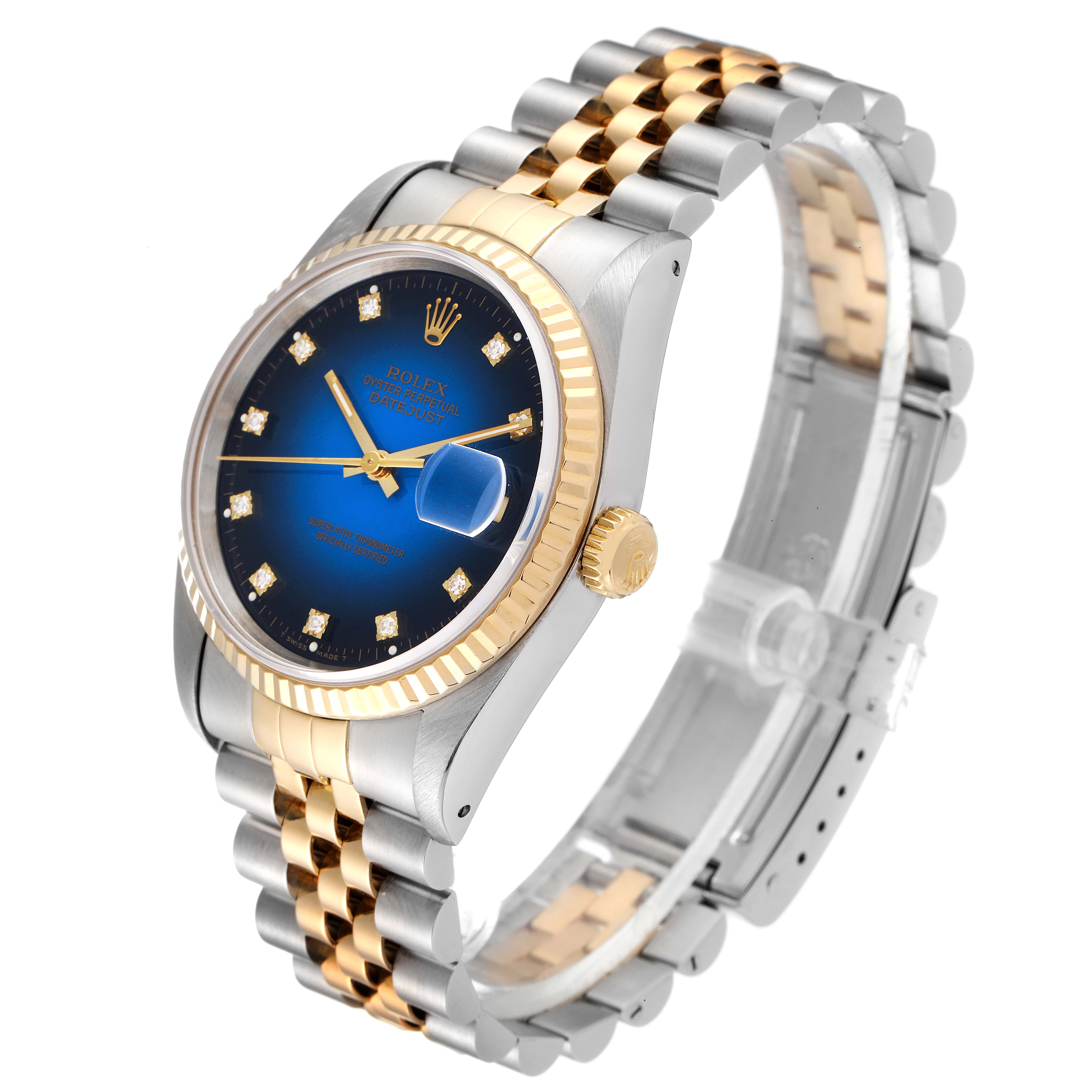 This image shows a Rolex Datejust 16233 Men's Steel and Gold (two tone) Blue Dial 16233 Men's Steel and Gold (two tone) Blue Dial watch at a three-quarter angle, highlighting its blue dial, gold fluted bezel, and two-tone bracelet.
