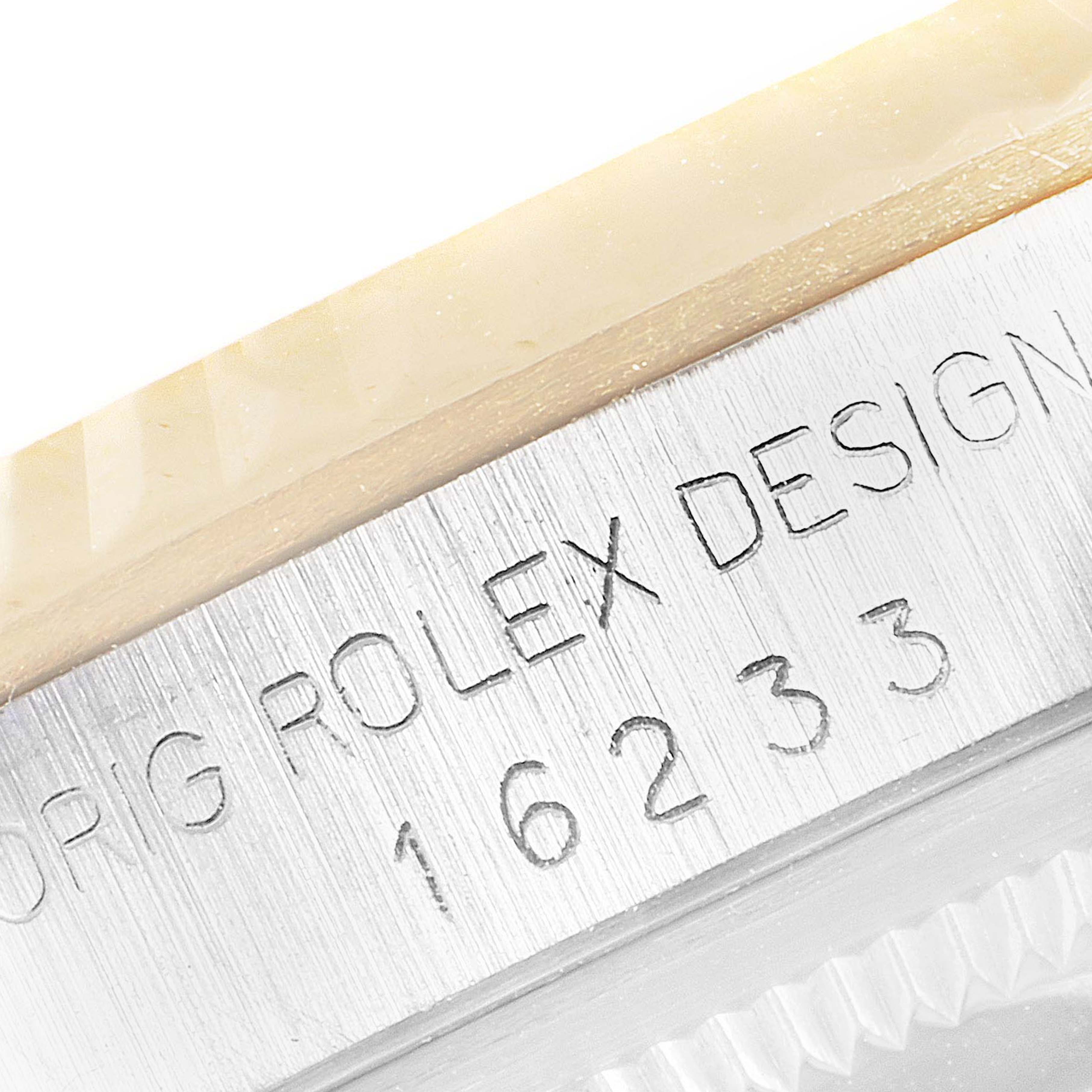 This is a close-up shot of the case side of a Rolex Datejust 16233 Men's Steel and Gold (two tone) White Dial 16233 Men's Steel and Gold (two tone) White Dial, showing the model number “16233” engraved on the metal.