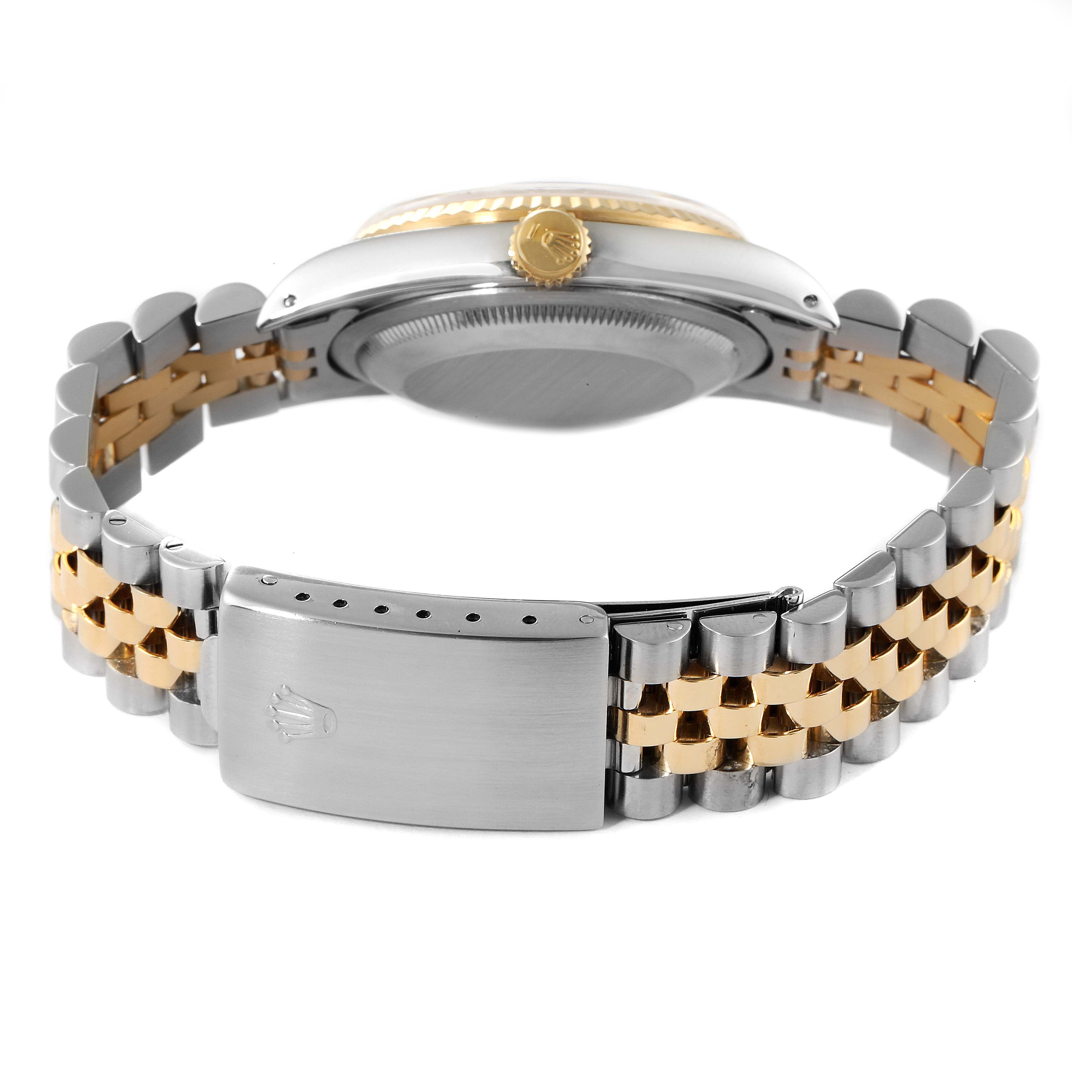 This image shows the backside of a Rolex Datejust 16233 Men's Steel and Gold (two tone) White Dial 16233 Men's Steel and Gold (two tone) White Dial watch, highlighting its clasp and bracelet.