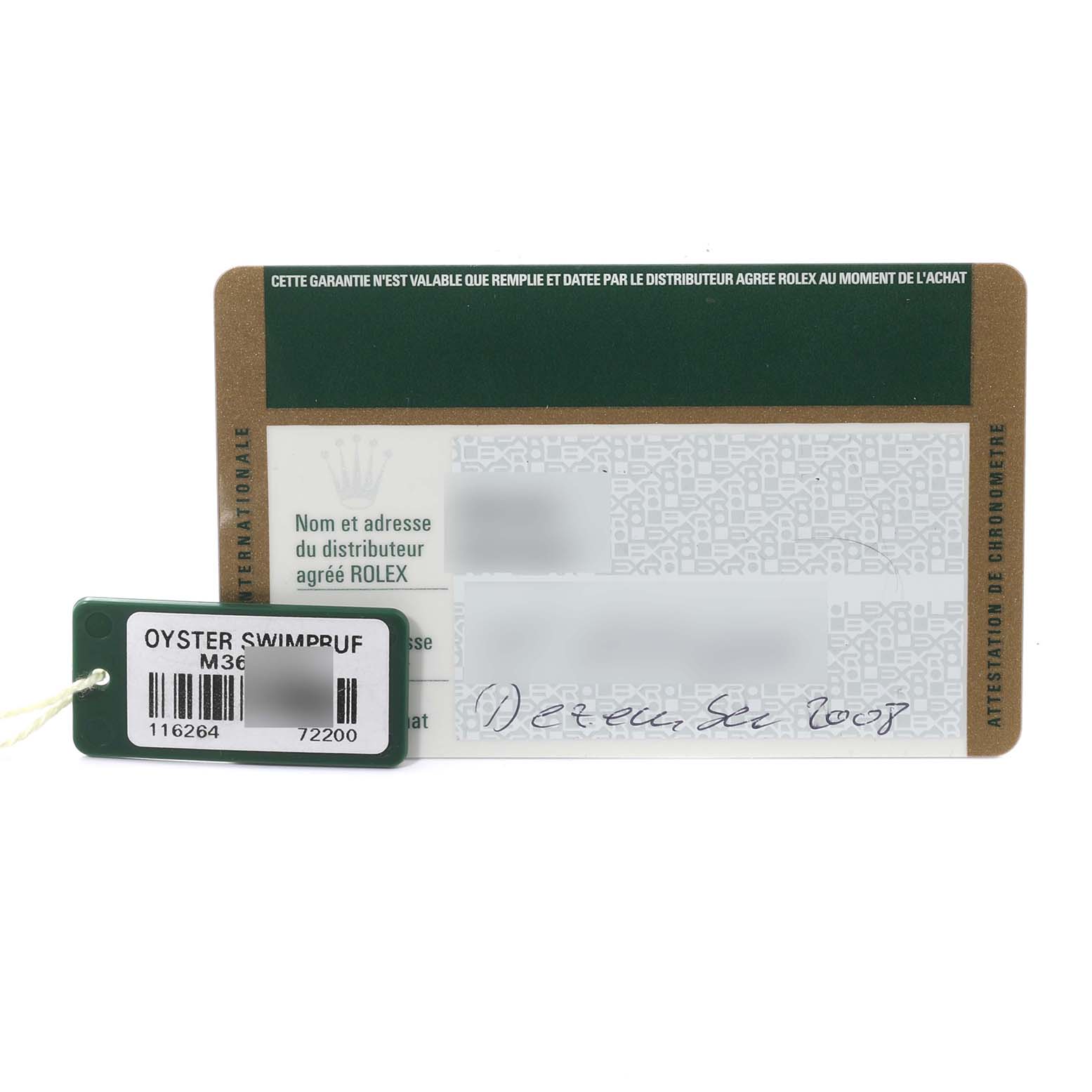 This image shows warranty cards and a hang tag for a Turn-o-Graph model by Rolex.