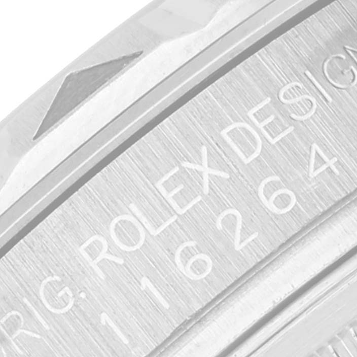 This close-up image shows the engraved design and part of the bezel on a Rolex Turn-o-Graph 116264 Men
s Stainless Steel Blue Dial 116264 Men
s Stainless Steel Blue Dial watch.