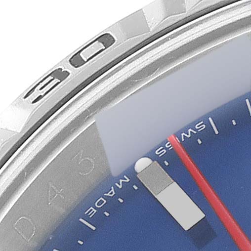 The image shows a close-up of the bezel and part of the dial of a Rolex Turn-o-Graph 116264 Men
s Stainless Steel Blue Dial 116264 Men
s Stainless Steel Blue Dial watch, including the 30 marker and the red second hand.