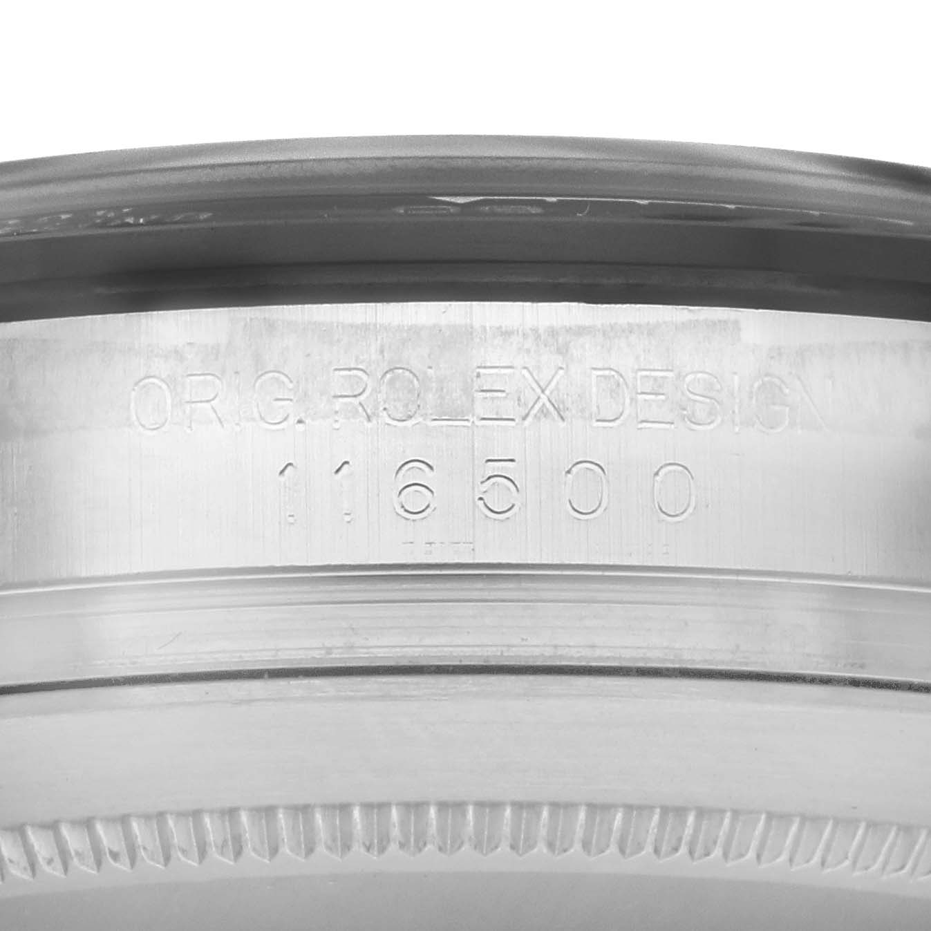 The image shows the engraved side of the bezel and casing of a Rolex Daytona 116500 Men
s Stainless Steel White Dial watch.