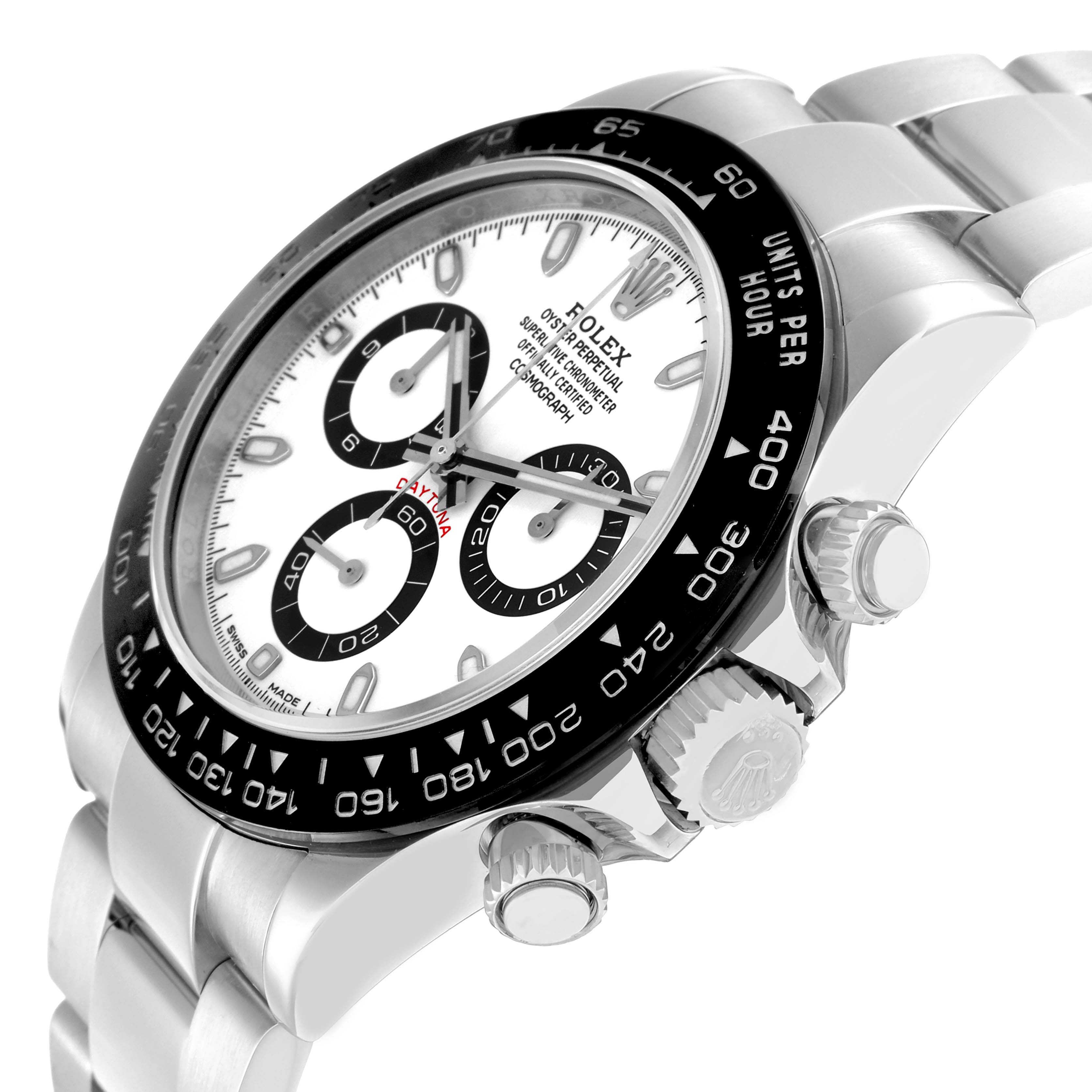 The Rolex Daytona 116500 Men
s Stainless Steel White Dial watch is shown at a slight side angle, highlighting the bezel, crown, pushers, and bracelet.