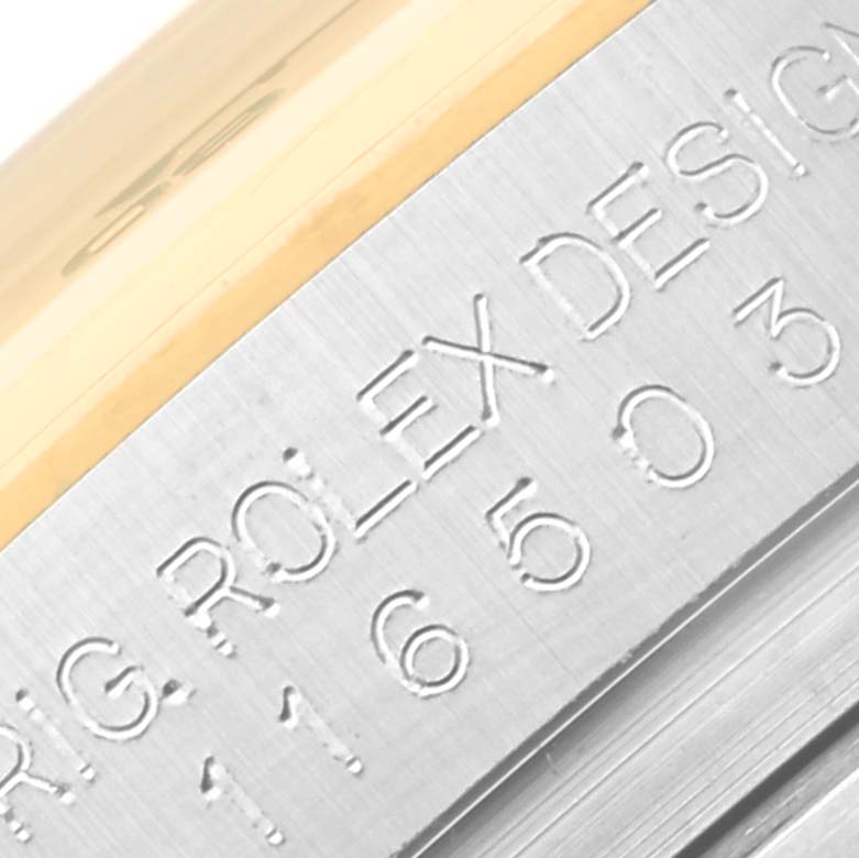 The close-up image shows part of the bezel with engravings from a Rolex Daytona 116503 Men's Steel and Gold (two tone) Mother of Pearl Dial 116503 Men's Steel and Gold (two tone) Mother of Pearl Dial watch.