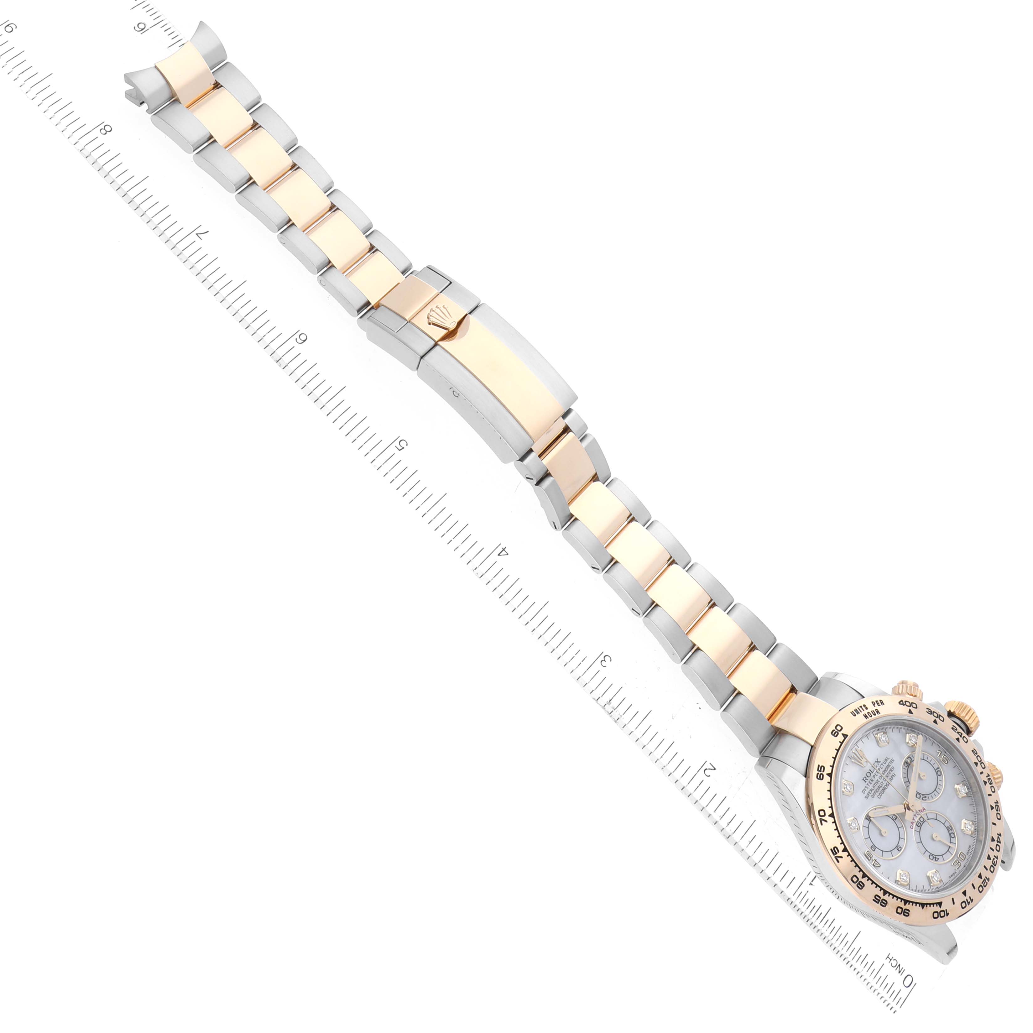 This image shows a Rolex Daytona 116503 Men's Steel and Gold (two tone) Mother of Pearl Dial 116503 Men's Steel and Gold (two tone) Mother of Pearl Dial watch laid flat at a diagonal angle, highlighting its bracelet, clasp, and dial.