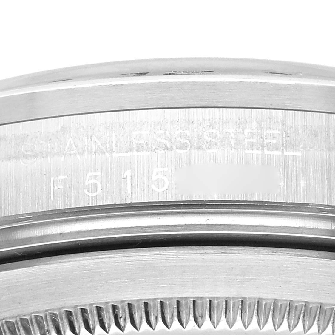 This close-up image shows the side engraving and part of the bezel of a Rolex Explorer 16570 Men
s Stainless Steel White Dial 16570 Men
s Stainless Steel White Dial watch.