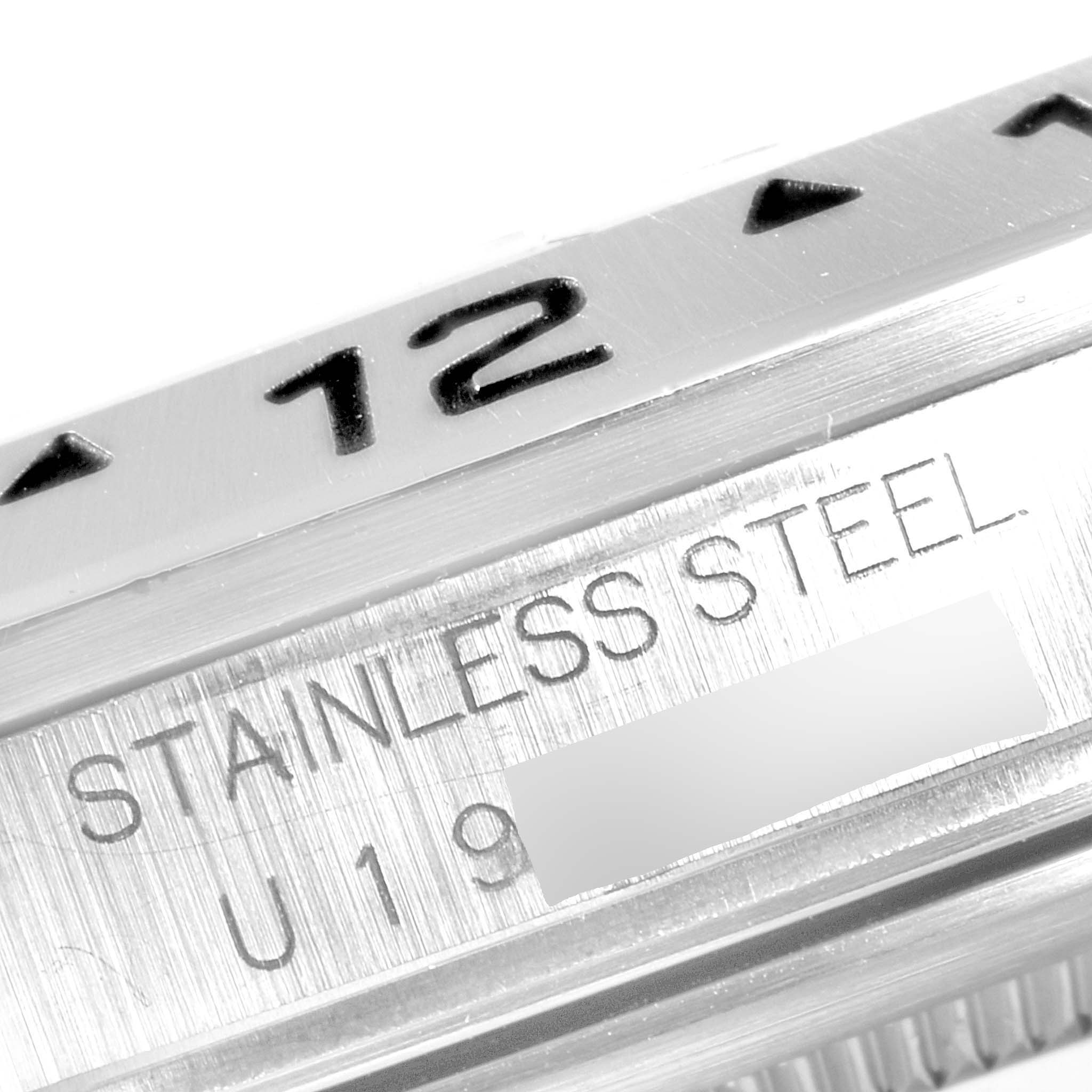 Close-up angle shows the bezel with "12", and "STAINLESS STEEL" engraving on a Rolex Explorer 16570 Men
s Stainless Steel Black Dial 16570 Men
s Stainless Steel Black Dial model.