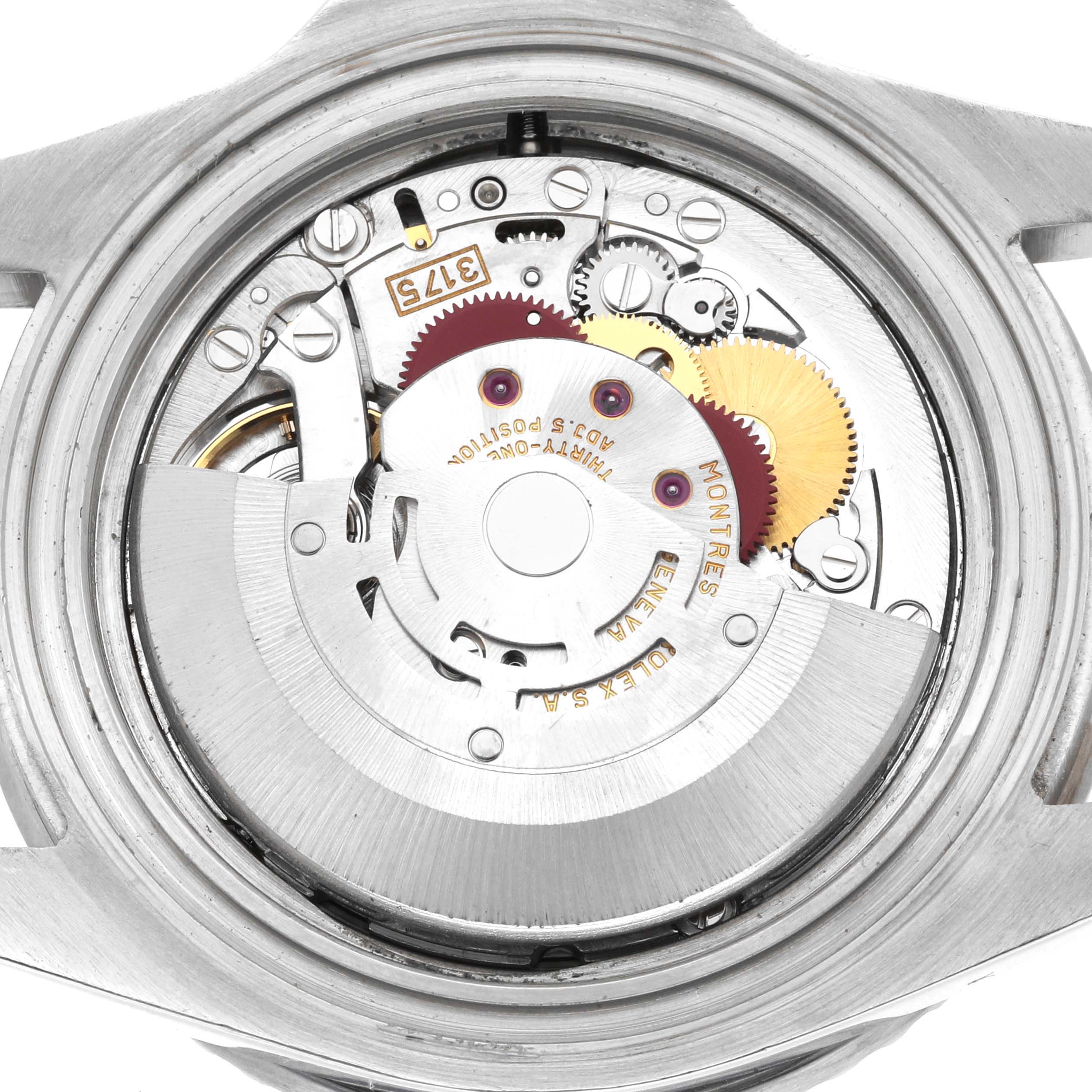 The image shows the movement mechanism of a Rolex GMT-Master 16700 Men
s Stainless Steel Black Dial watch from the back, highlighting gears and intricate parts.