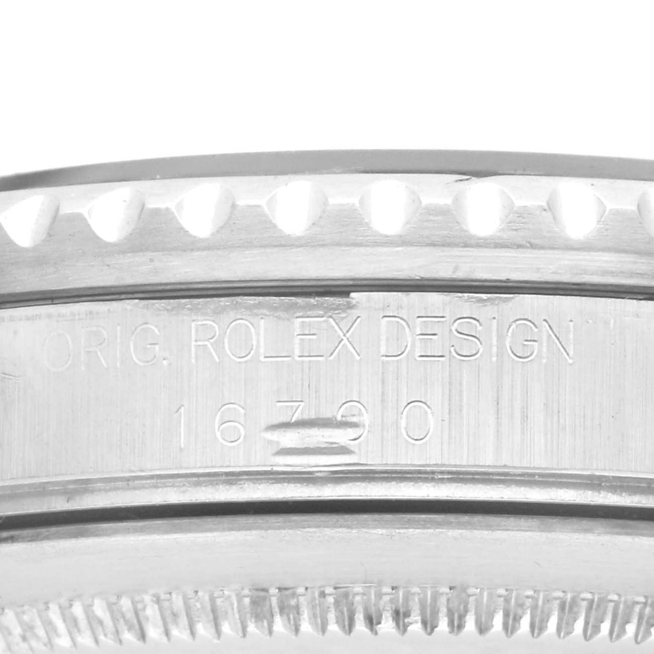The image shows the side view of a Rolex GMT-Master 16700 Men
s Stainless Steel Black Dial watch case, highlighting the model number and "Rolex Design" engraving.