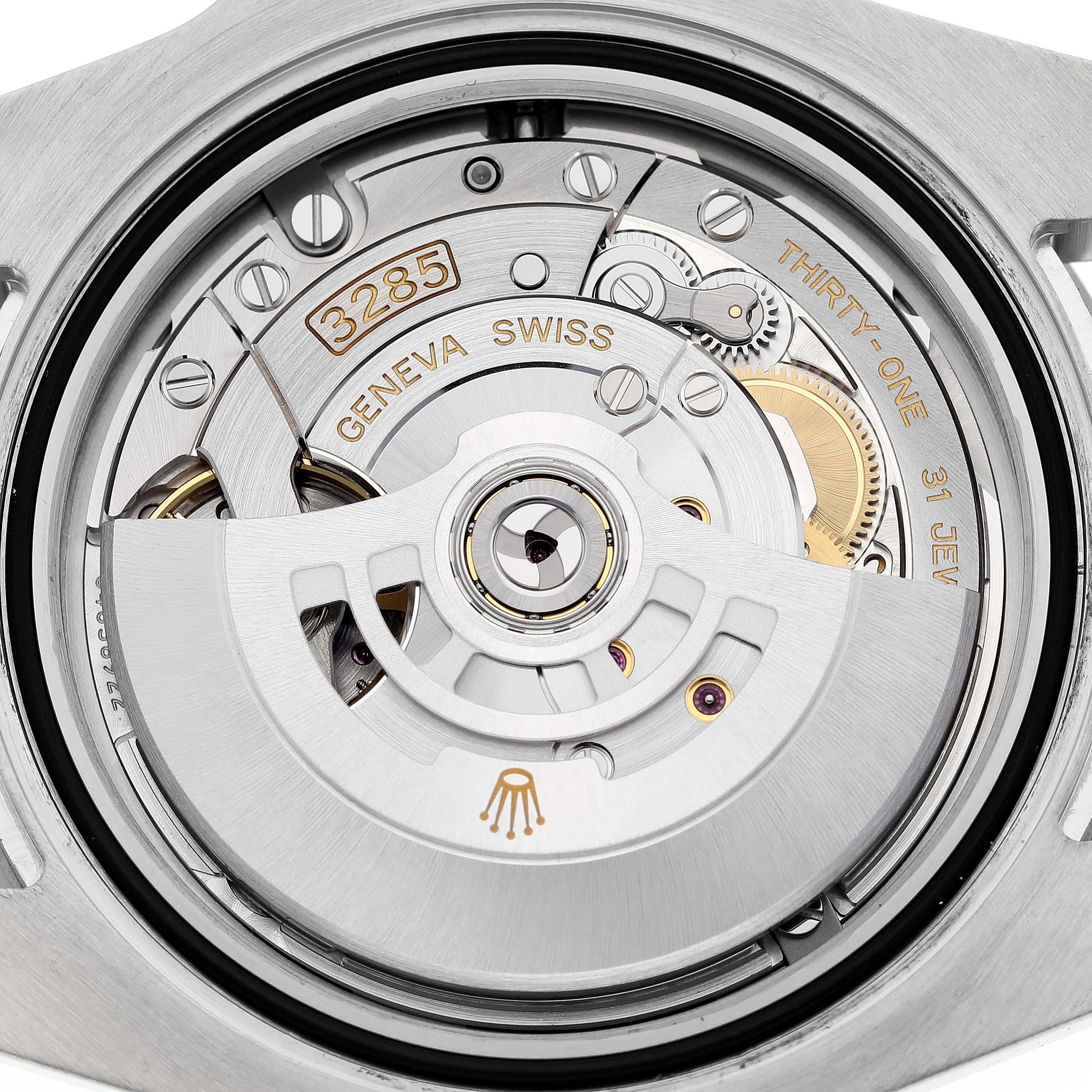 The image shows the back view of a Rolex GMT-Master 126710 Men
s Stainless Steel Black Dial 126710 Men
s Stainless Steel Black Dial watch, highlighting the intricate mechanical movement and engraving.