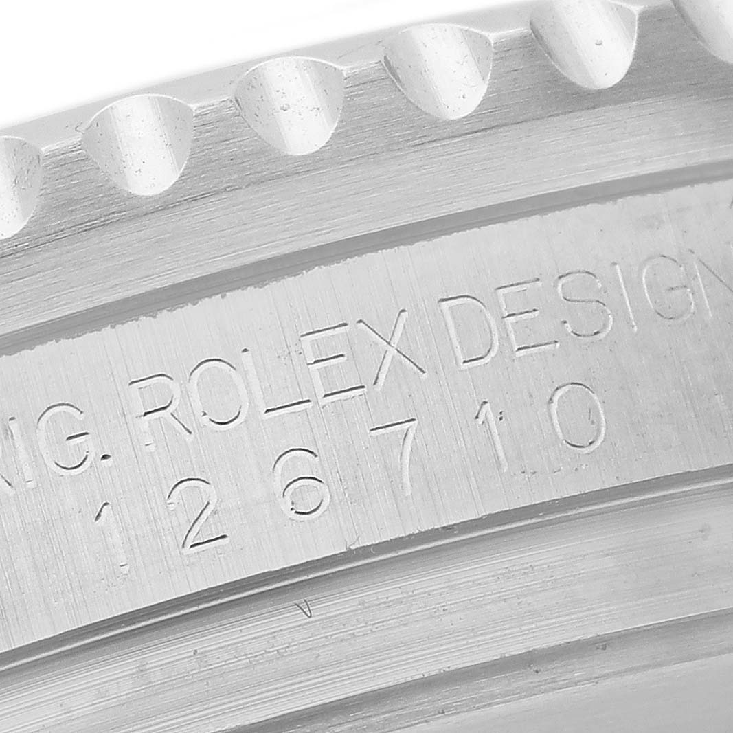 The image shows a close-up of the engraved reference number on the bezel side of a Rolex GMT-Master 126710 Men
s Stainless Steel Black Dial 126710 Men
s Stainless Steel Black Dial watch.